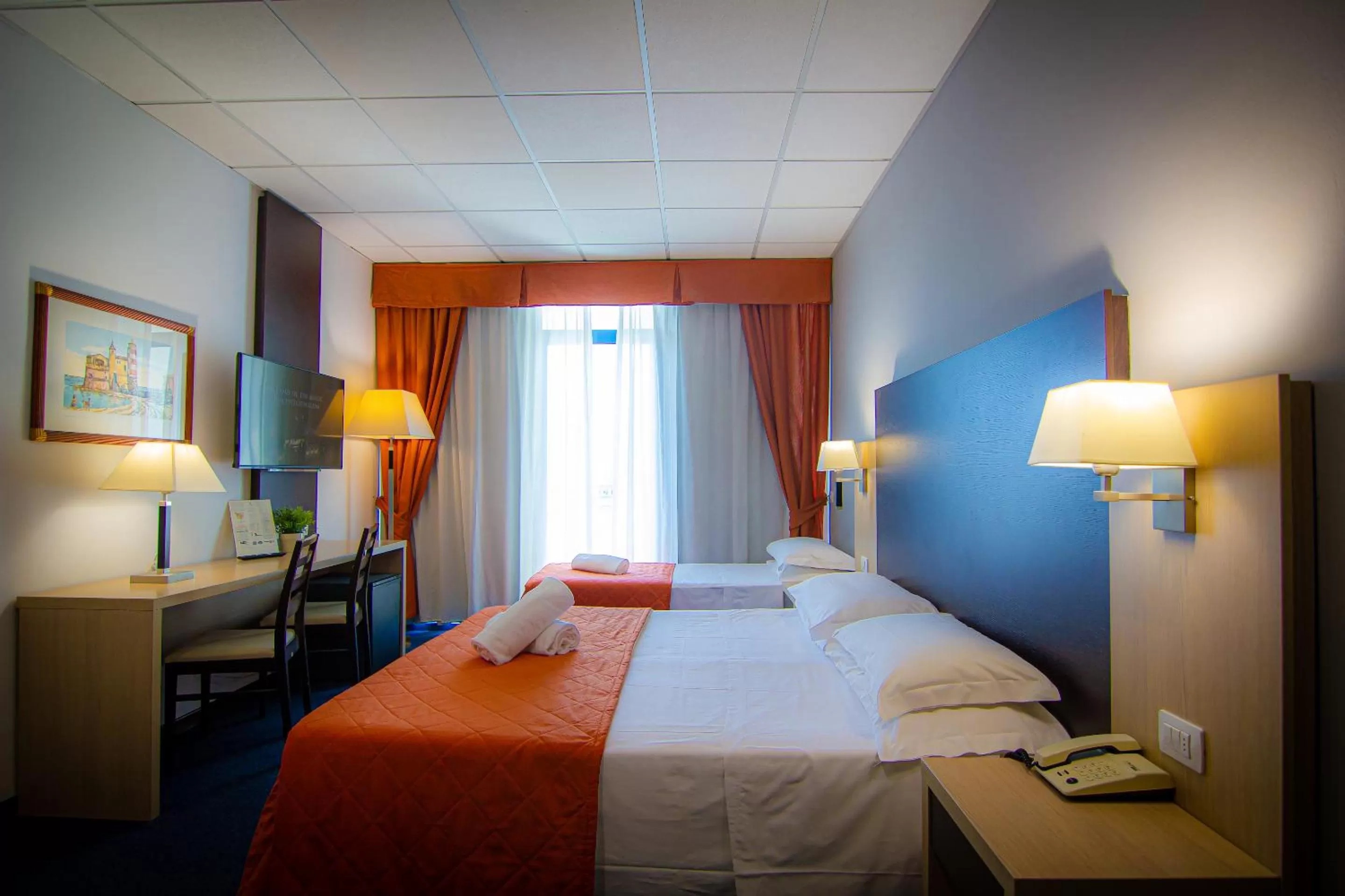 Economy Quadruple Room with Balcony in Tuscany Inn