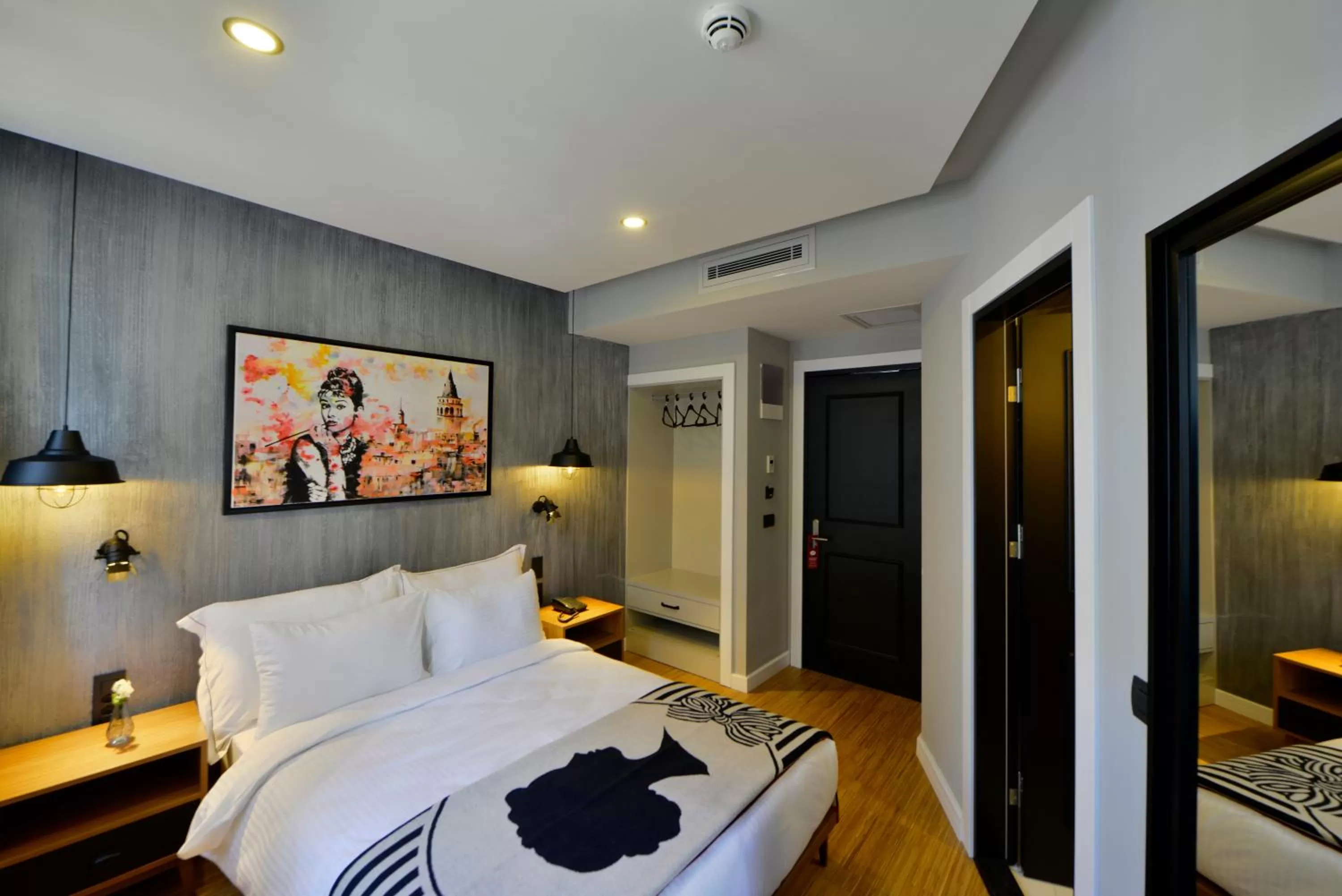 Photo of the whole room, Bed in Hotel Poem