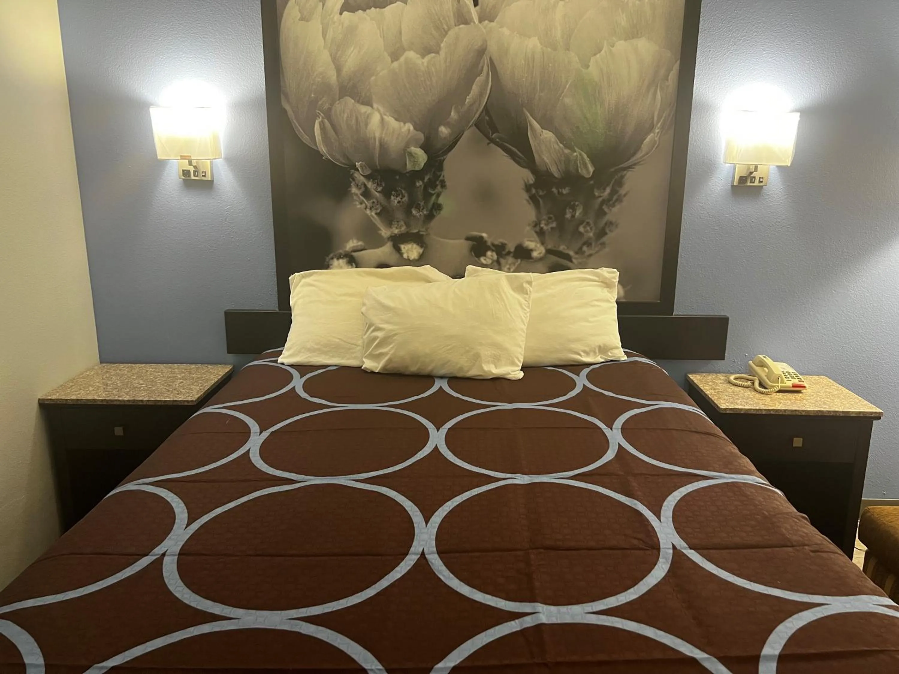 Bed in Super 8 by Wyndham Cleveland TX