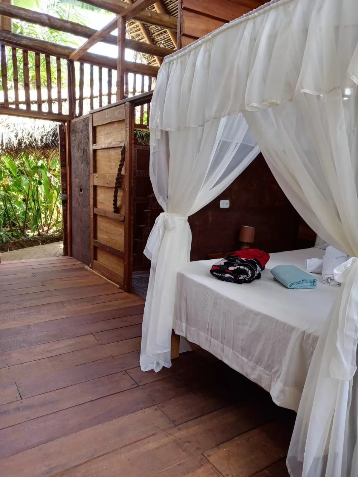 Bed in Iguanitas Lodge