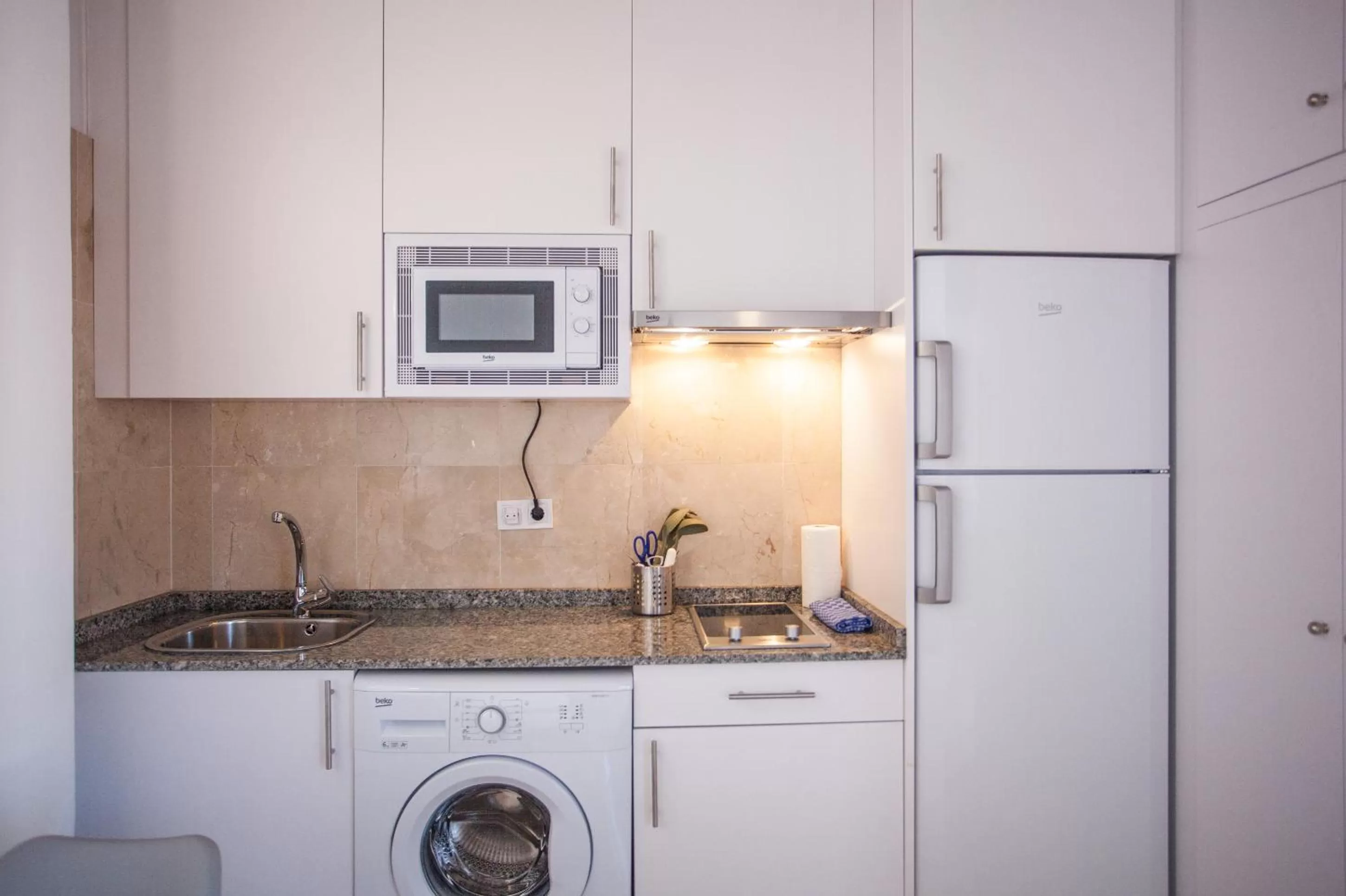 Kitchen or kitchenette in Gran Central Suites