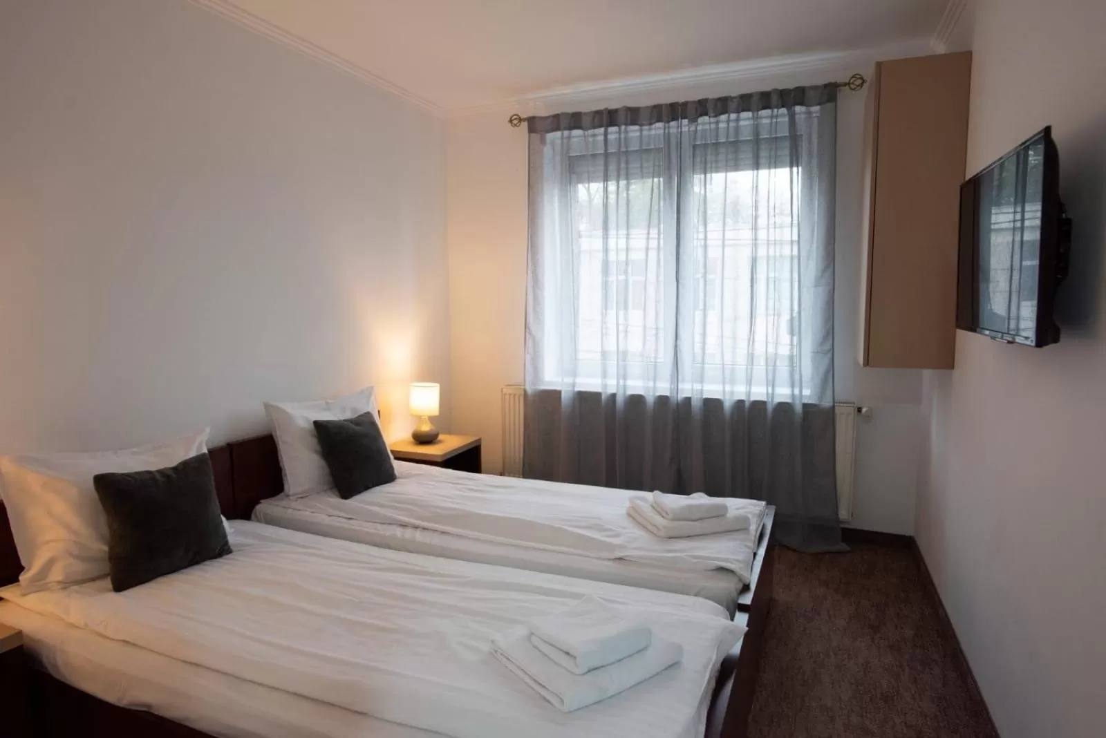 Bed in Carnival City Hotel Oradea