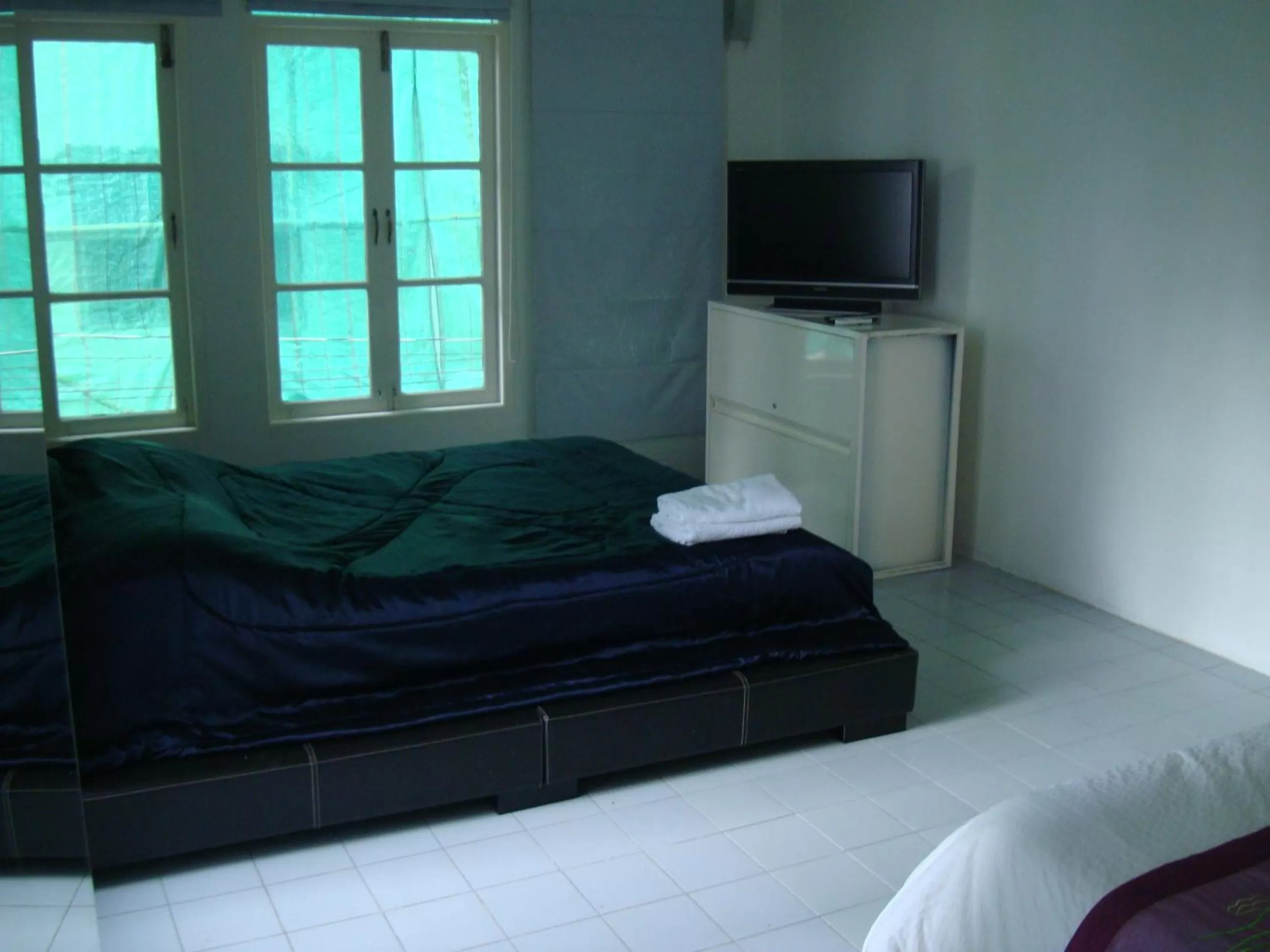 Bed in Oriental Smile Hotel