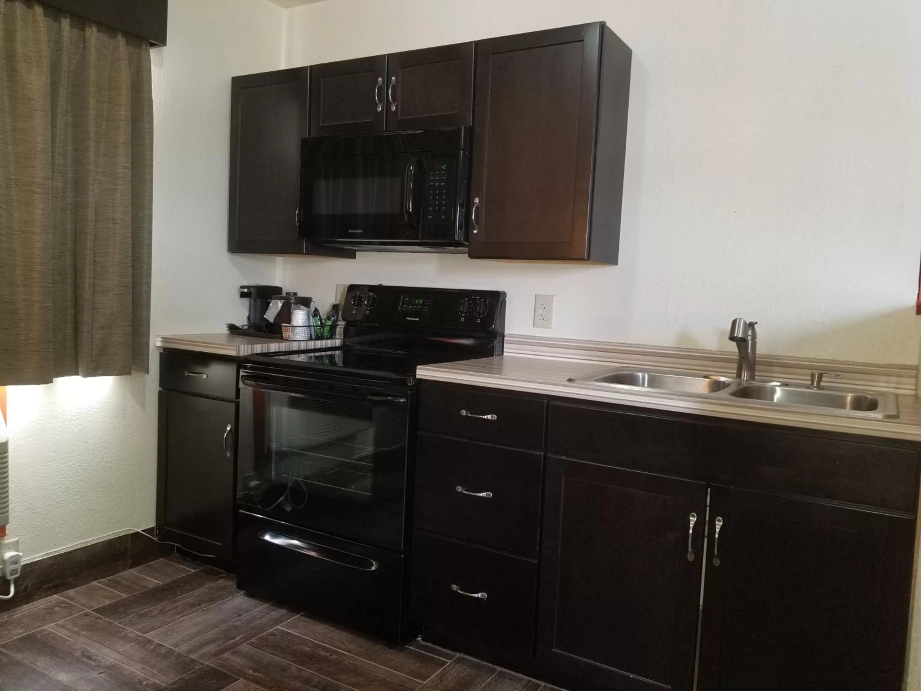 Kitchen or kitchenette in Baymont by Wyndham Eau Claire WI