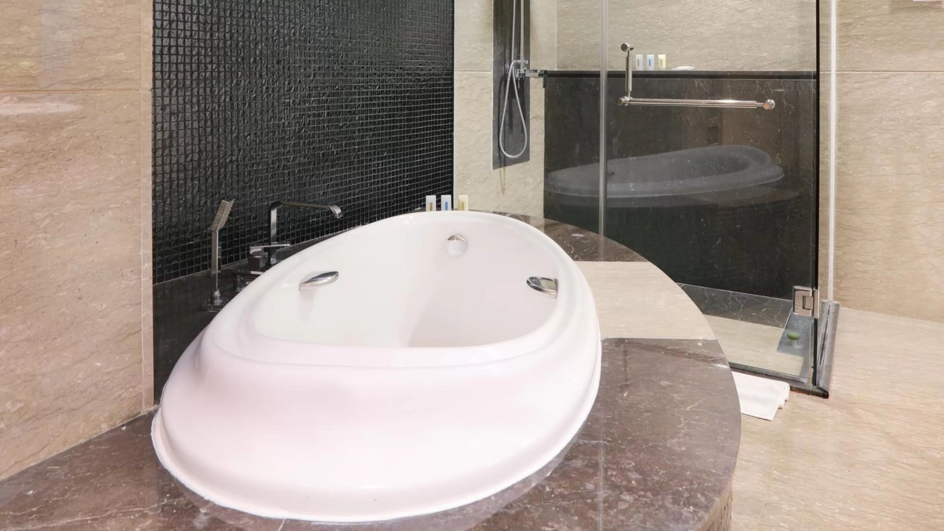 Bathroom in Holiday Inn Bandung Pasteur by IHG