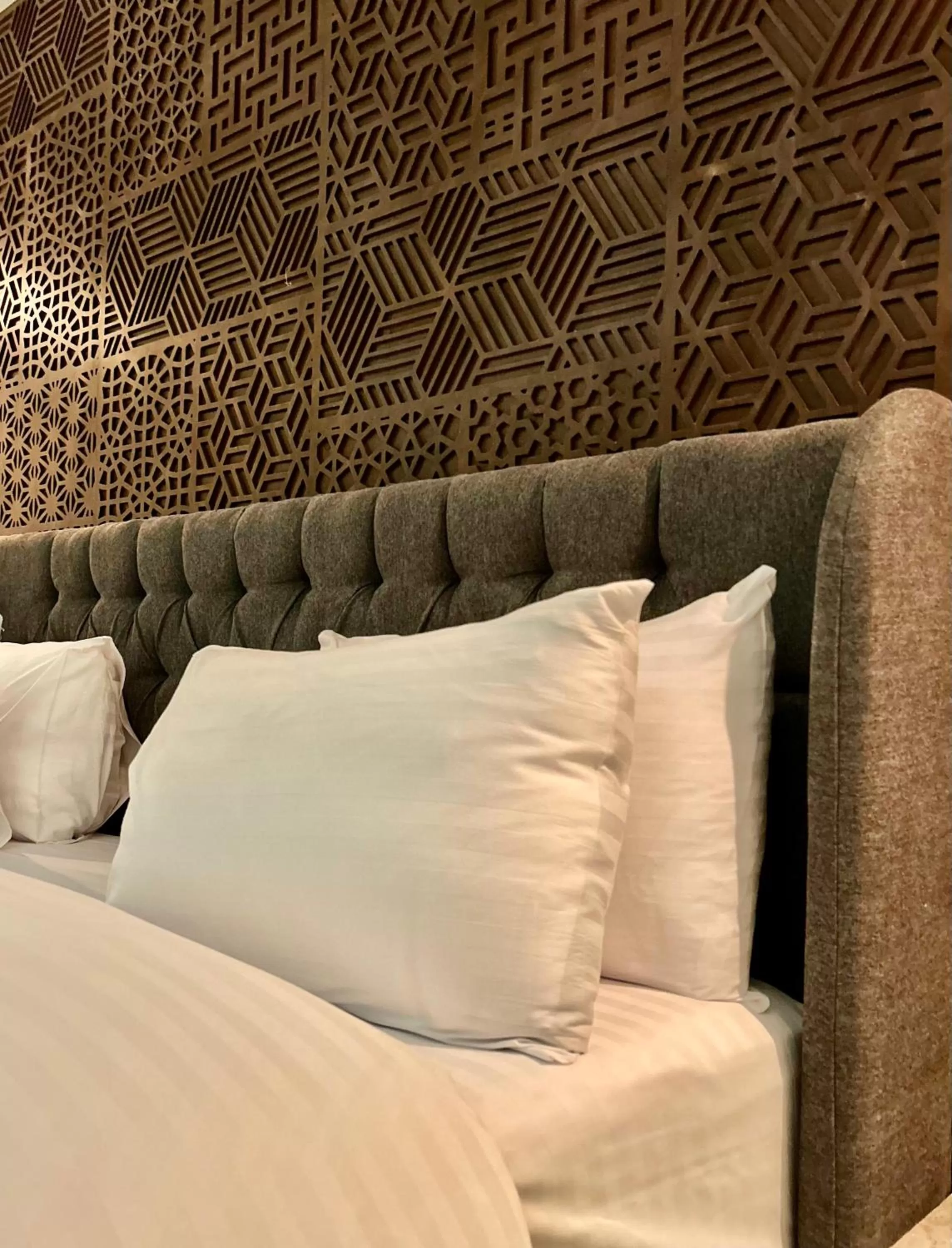 Bed in Tajreed Suites