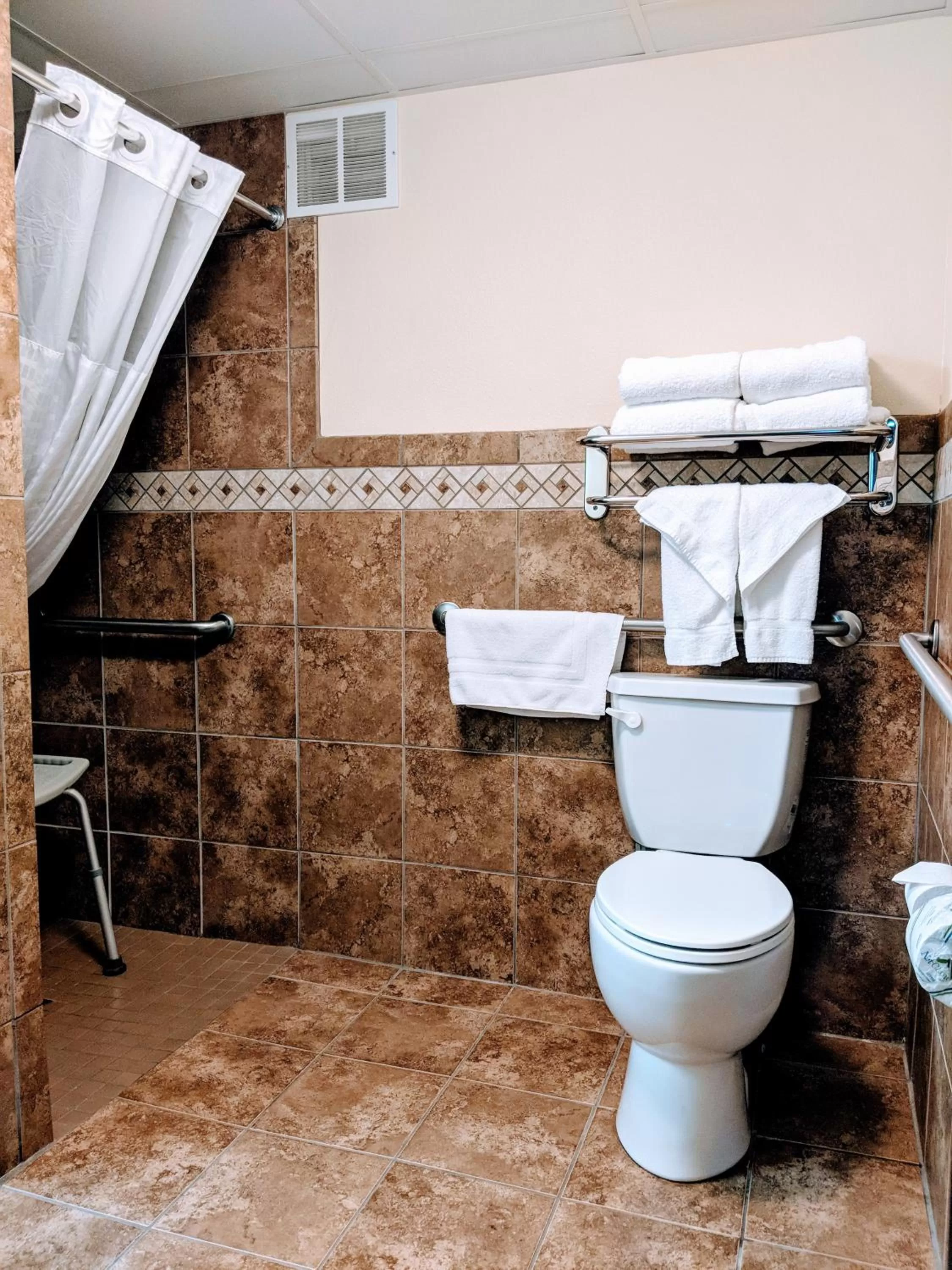 Shower in AmericInn by Wyndham Grand Forks