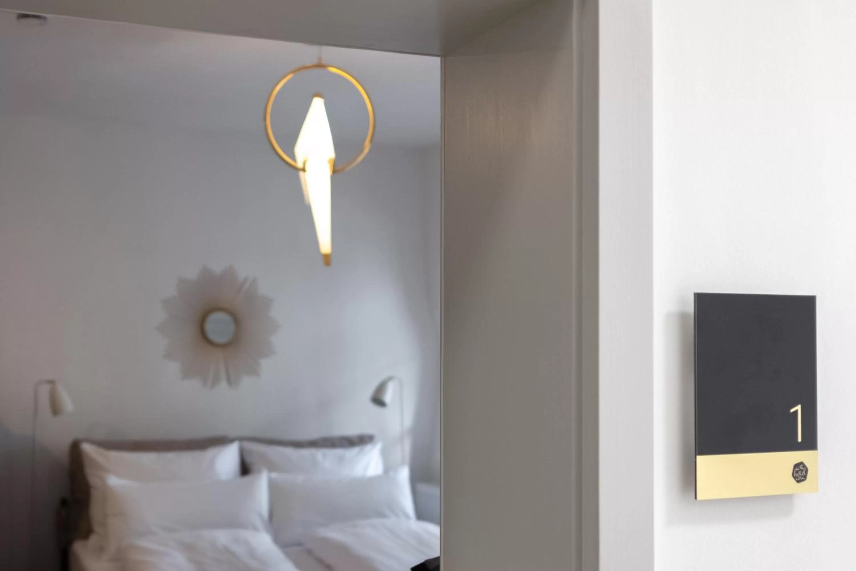 Photo of the whole room, Bed in ANA Living Augsburg City Center by Arthotel ANA - Self-Service-Hotel