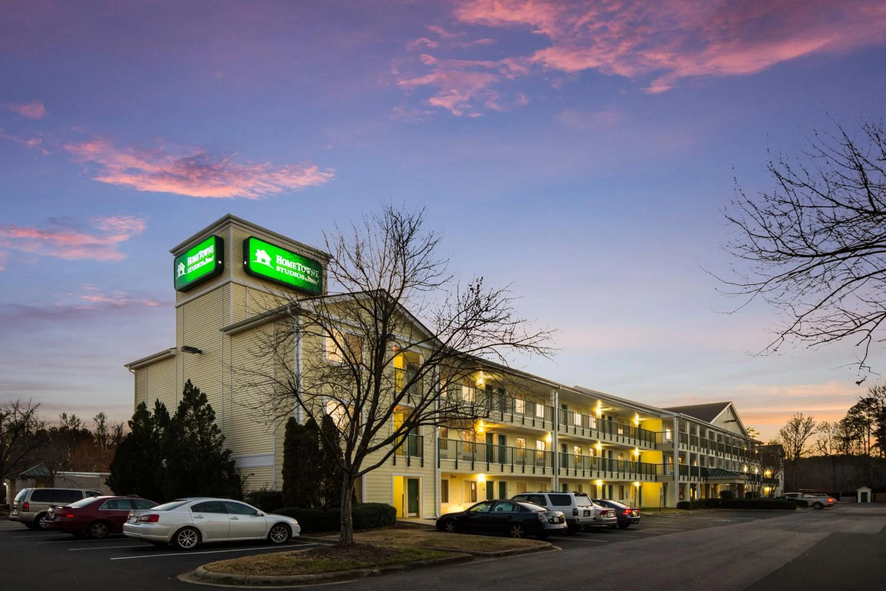 Property building in HomeTowne Studios by Red Roof Raleigh – Durham