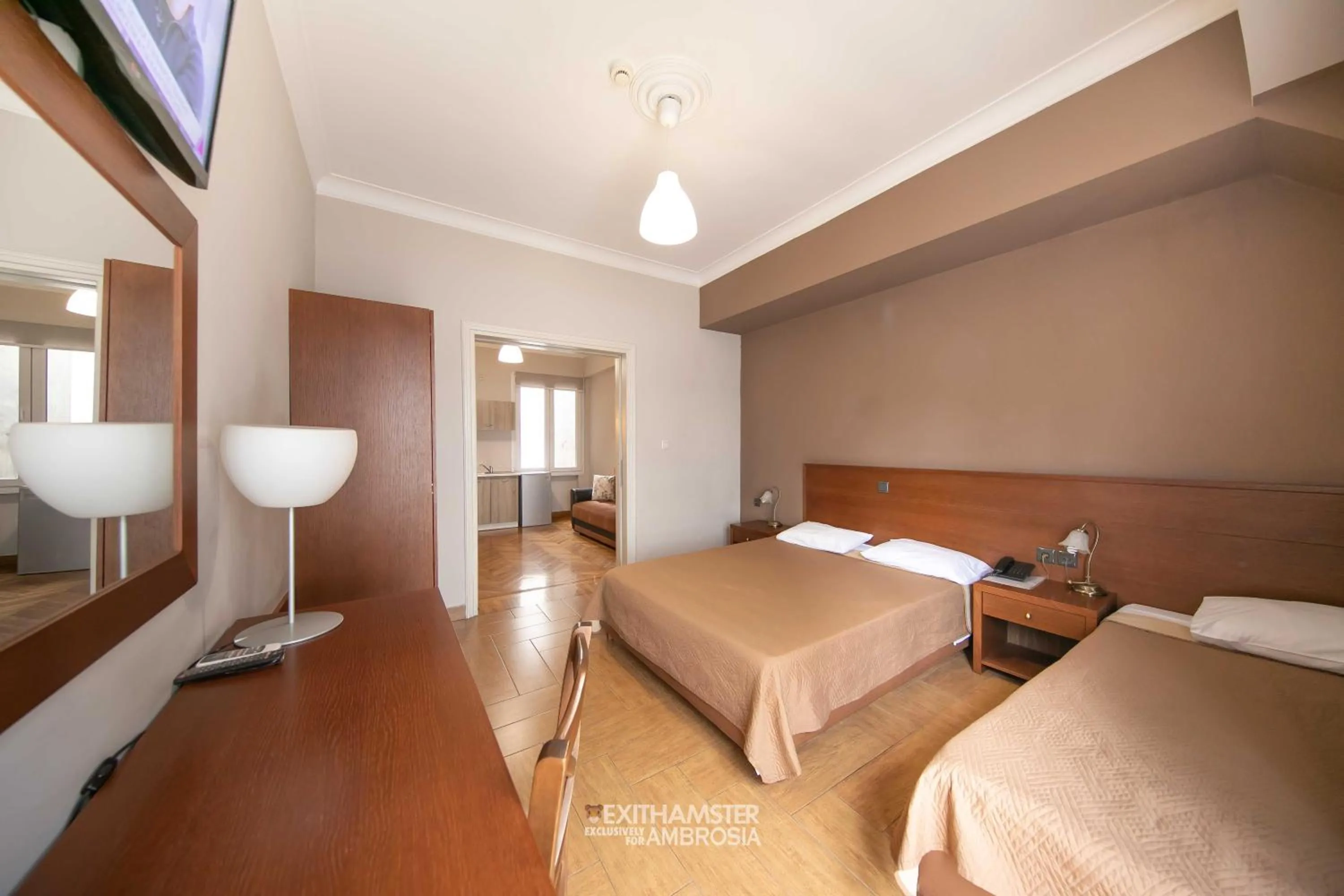 Seating area, Bed in Ambrosia Suites