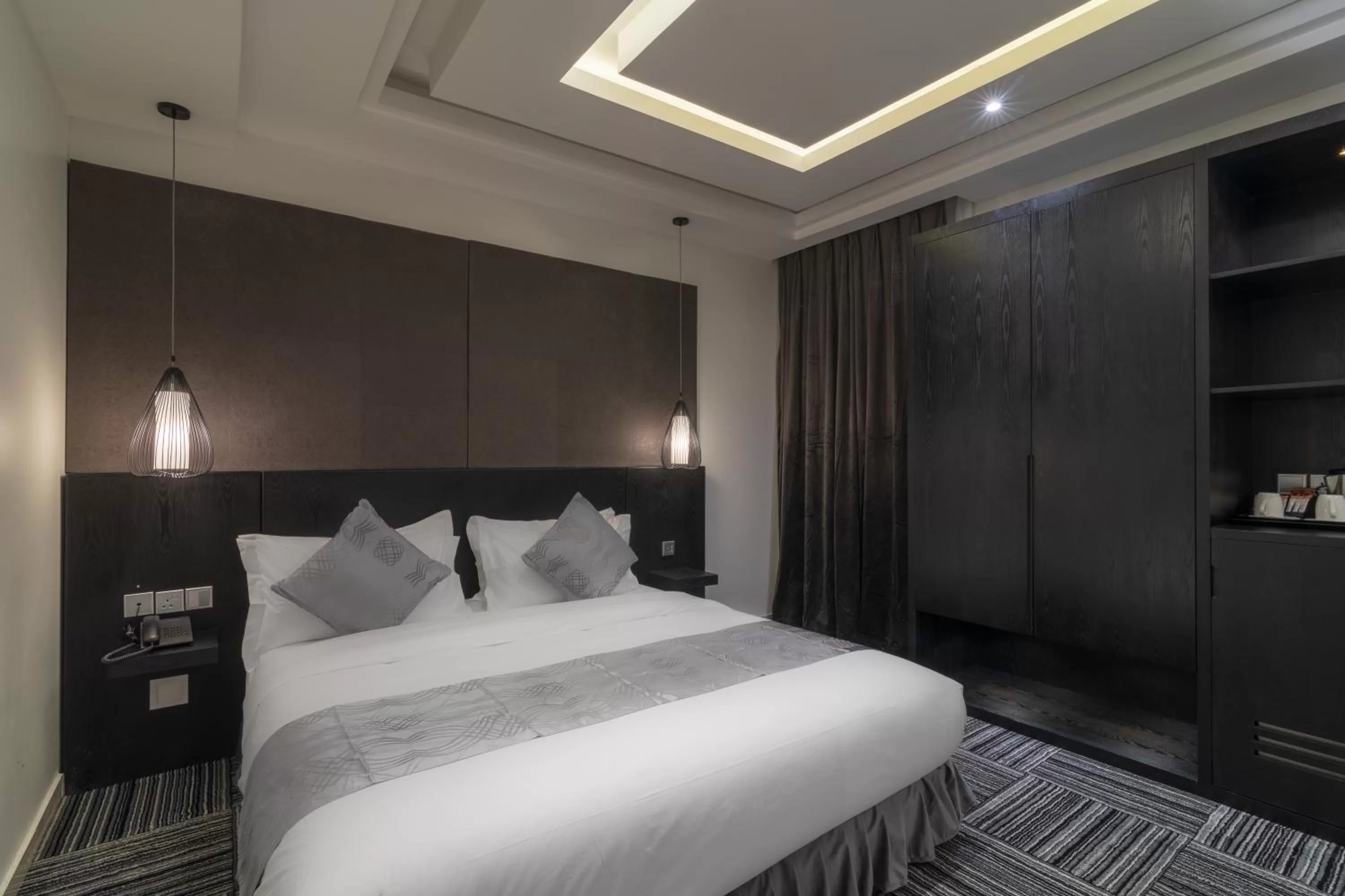 Bed in South Hotel Suites