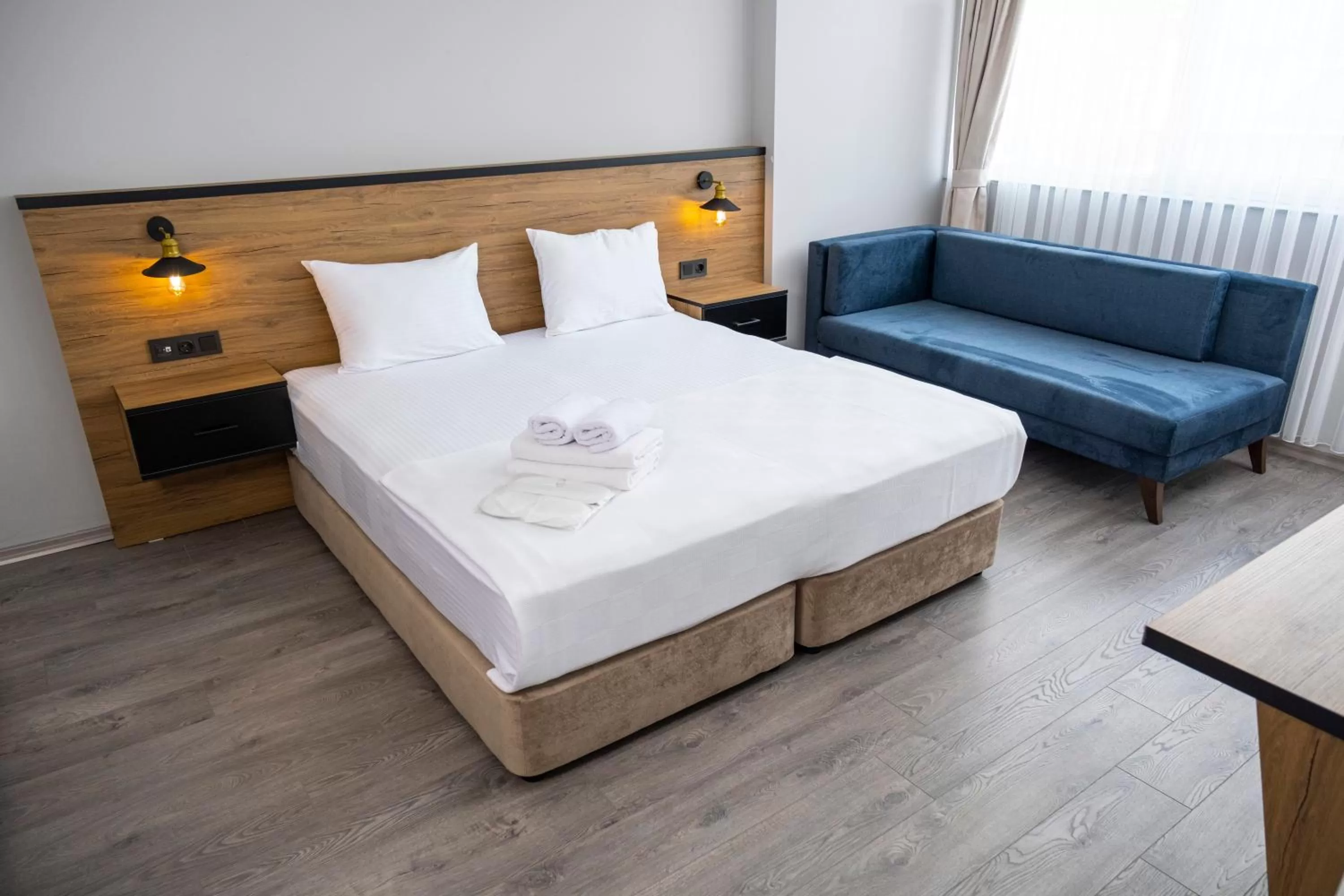 Bed in Comfort Center Suit Hotel