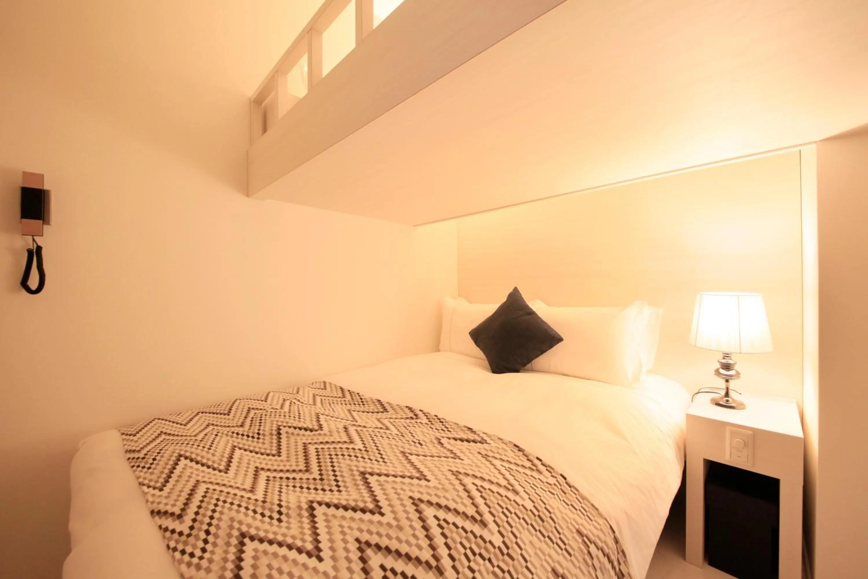 Photo of the whole room, Bed in Centurion Hotel Residential Akasaka Station