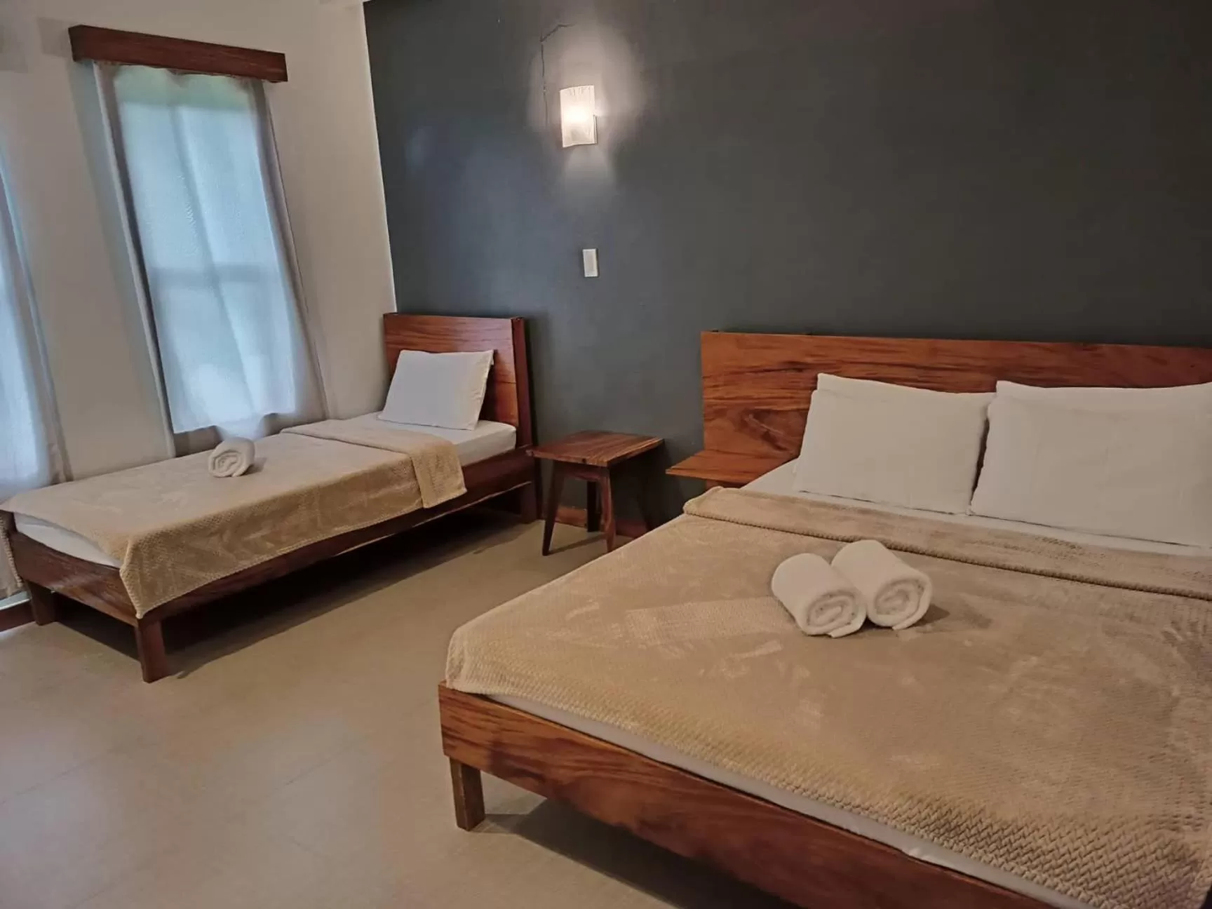 Bed in Acacia Garden Inn and Suites