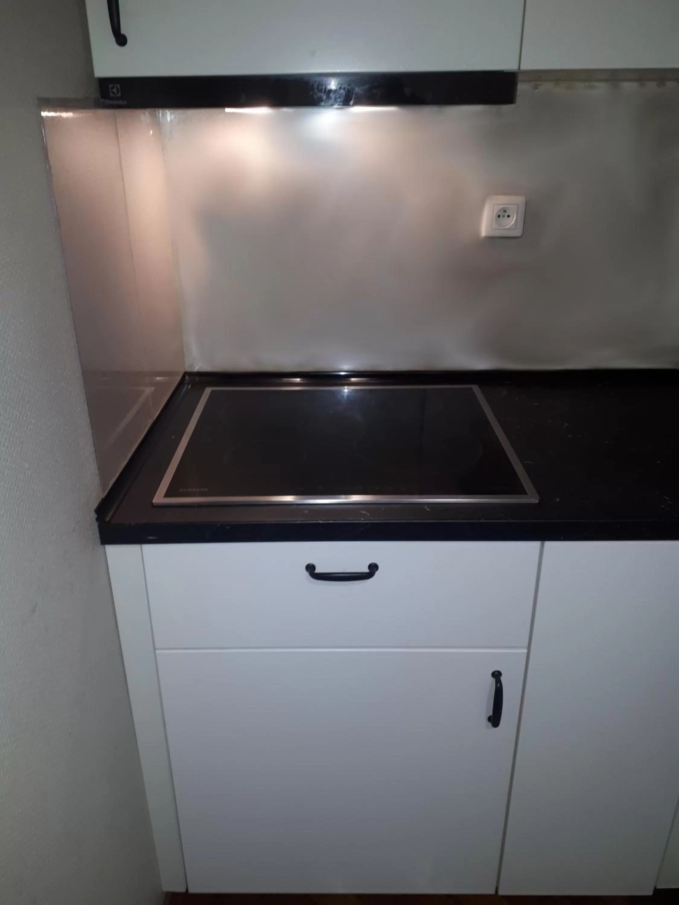 Communal kitchen in Rembrandt Aparthotel