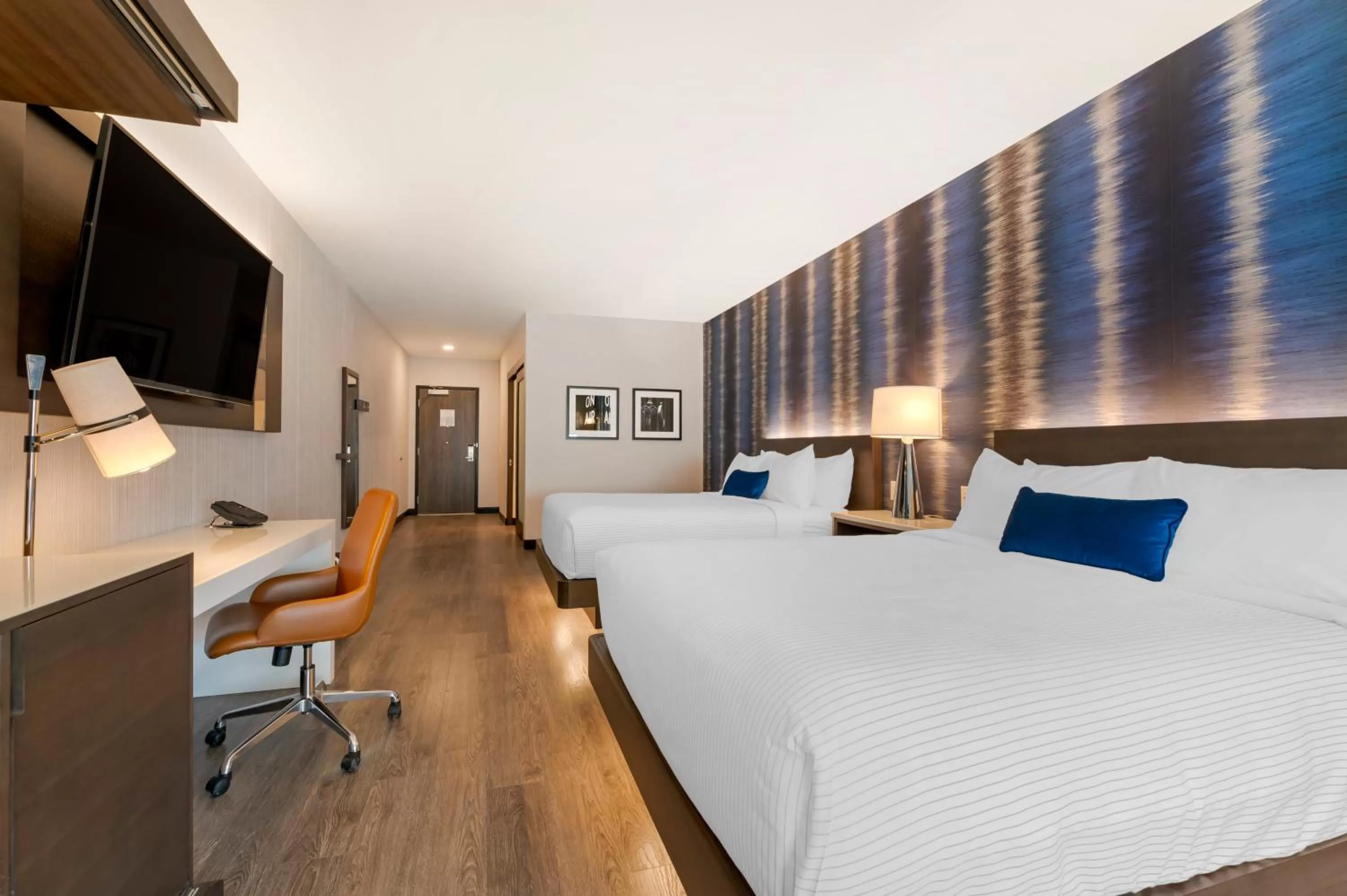 Bed in Cambria Hotel Detroit Downtown