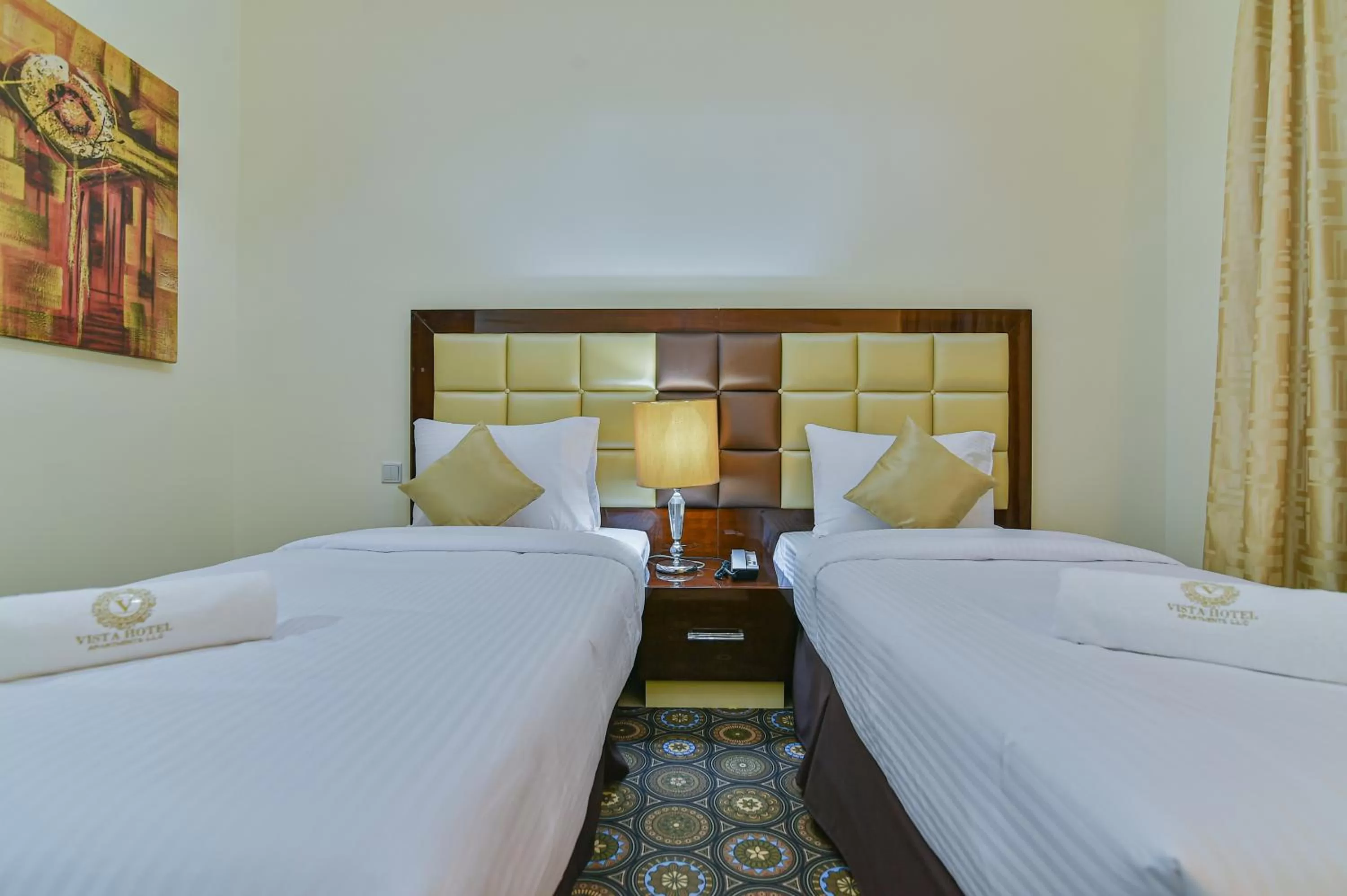 Bed in VISTA HOTEL APARTMENTS DELUXE