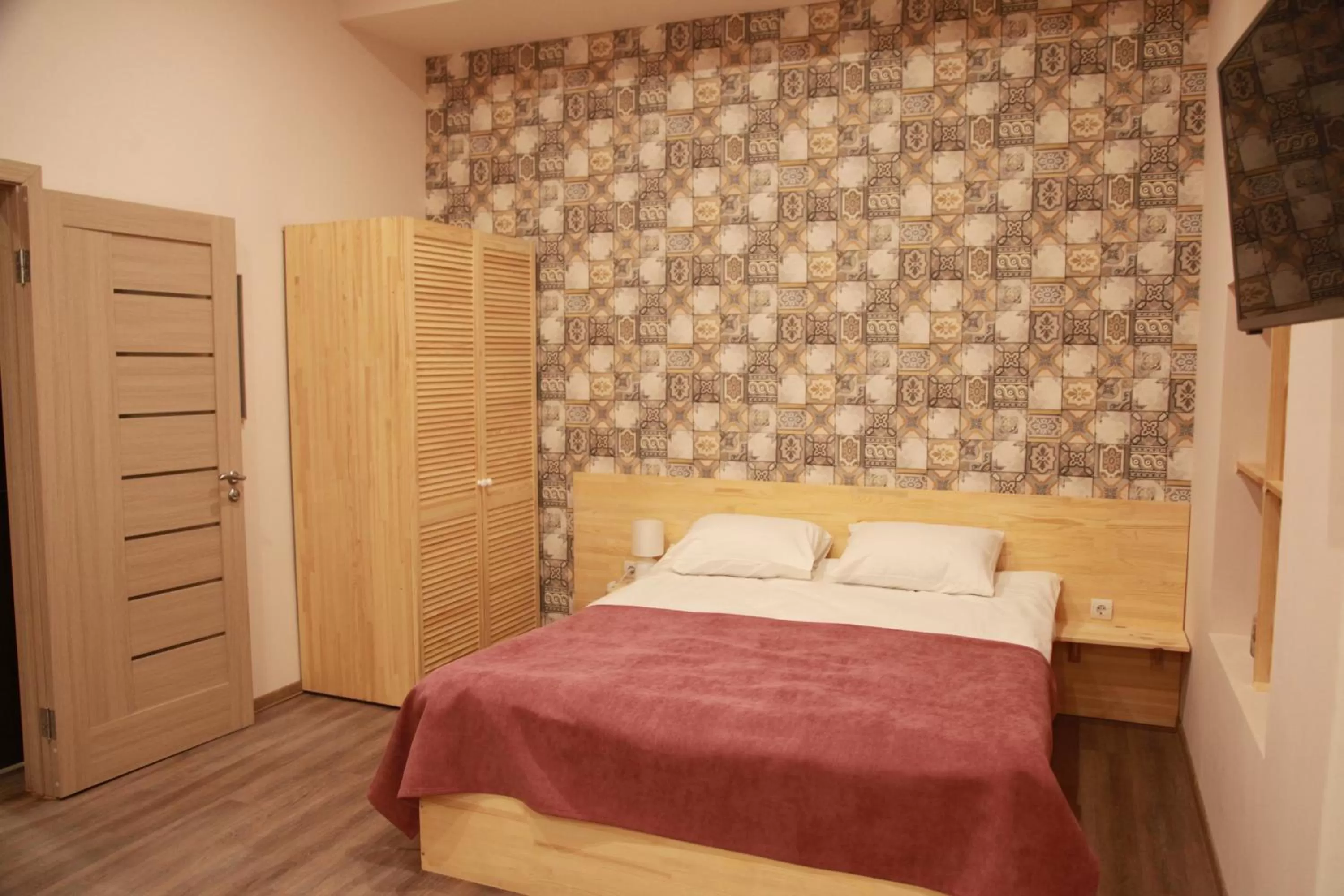 Bed in WINE & ROSE BOUTIQUE HOTEL