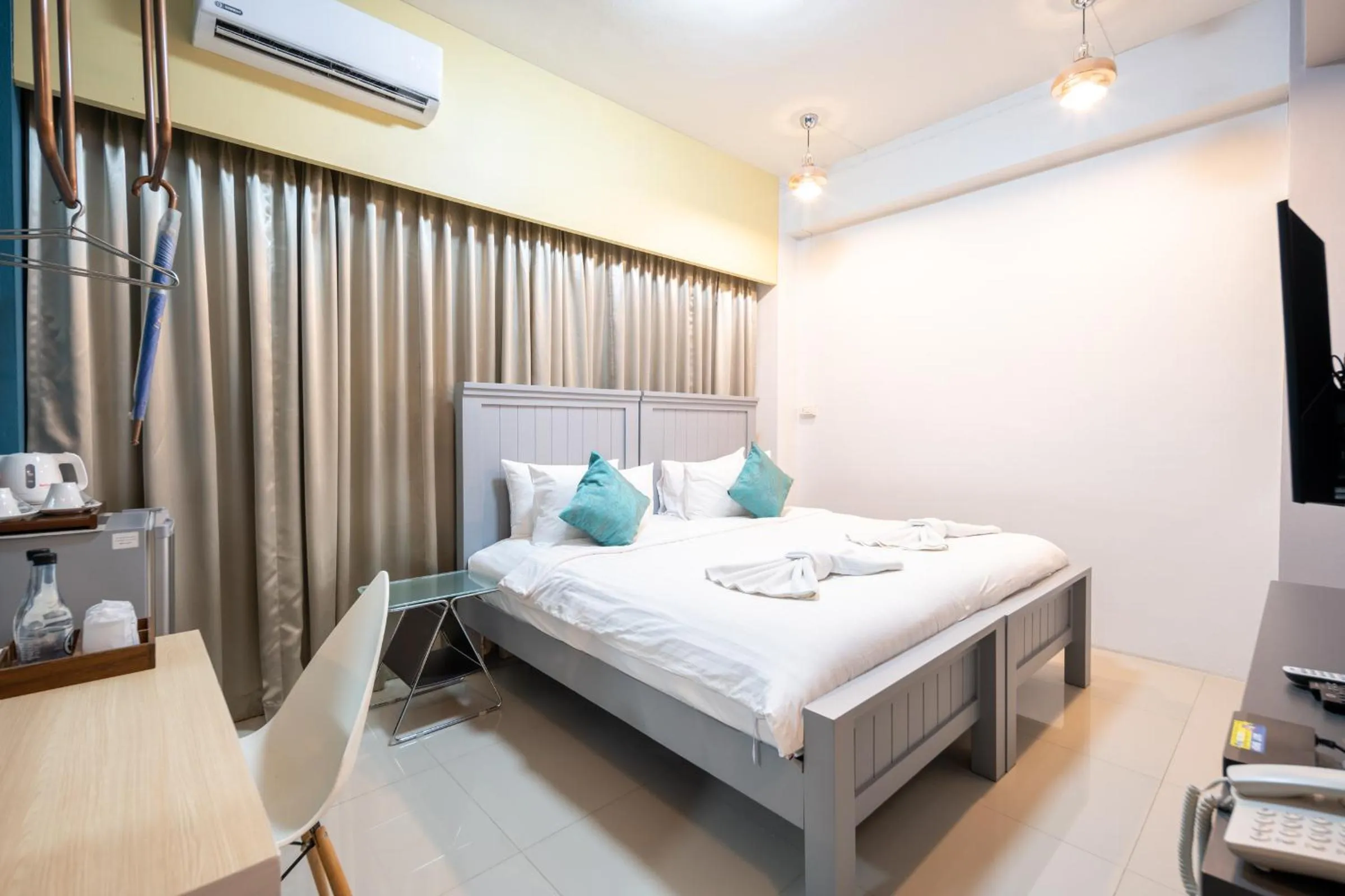 Bed in The Iconic Hotel Ranong