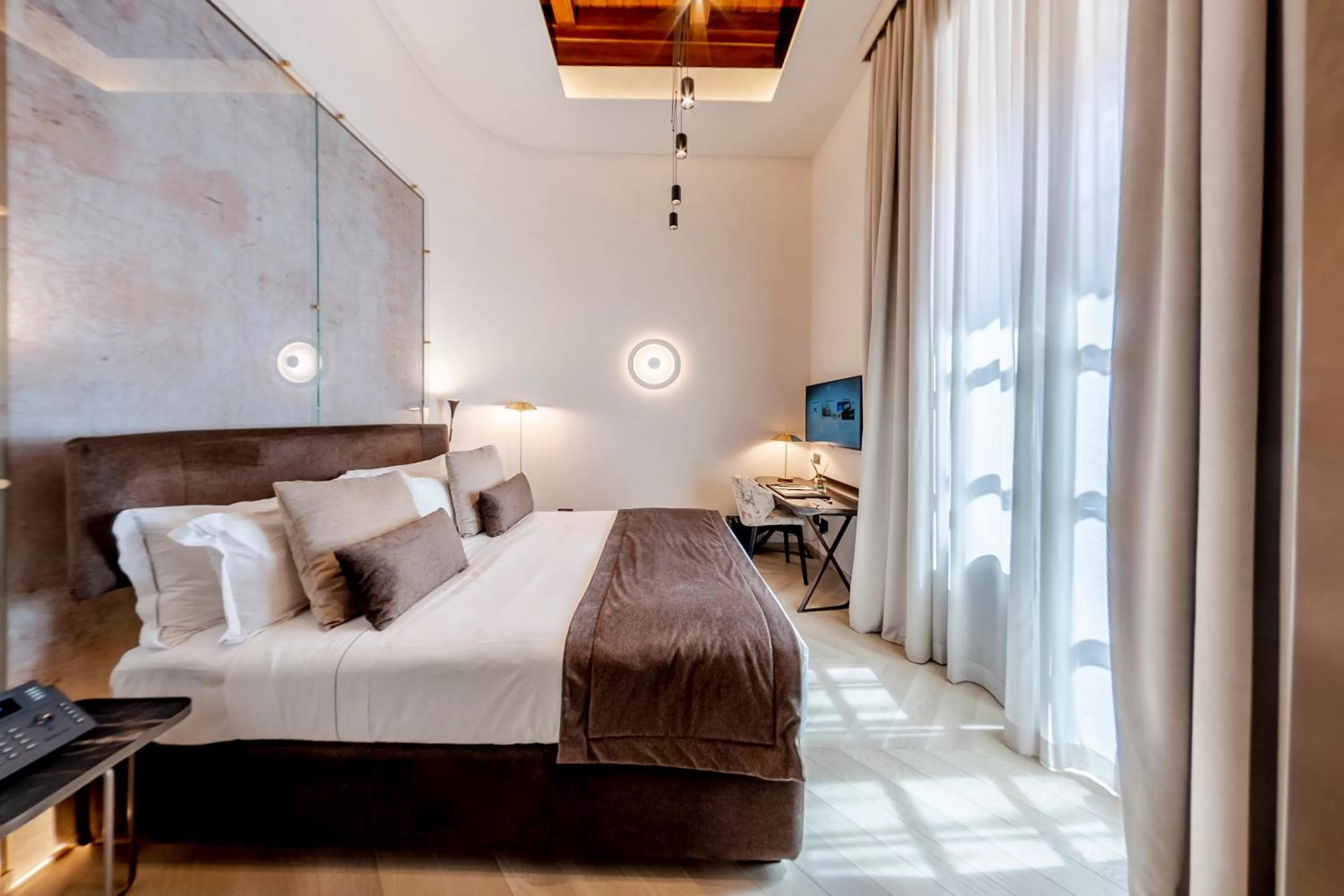 Bed in Martius Private Suites Hotel