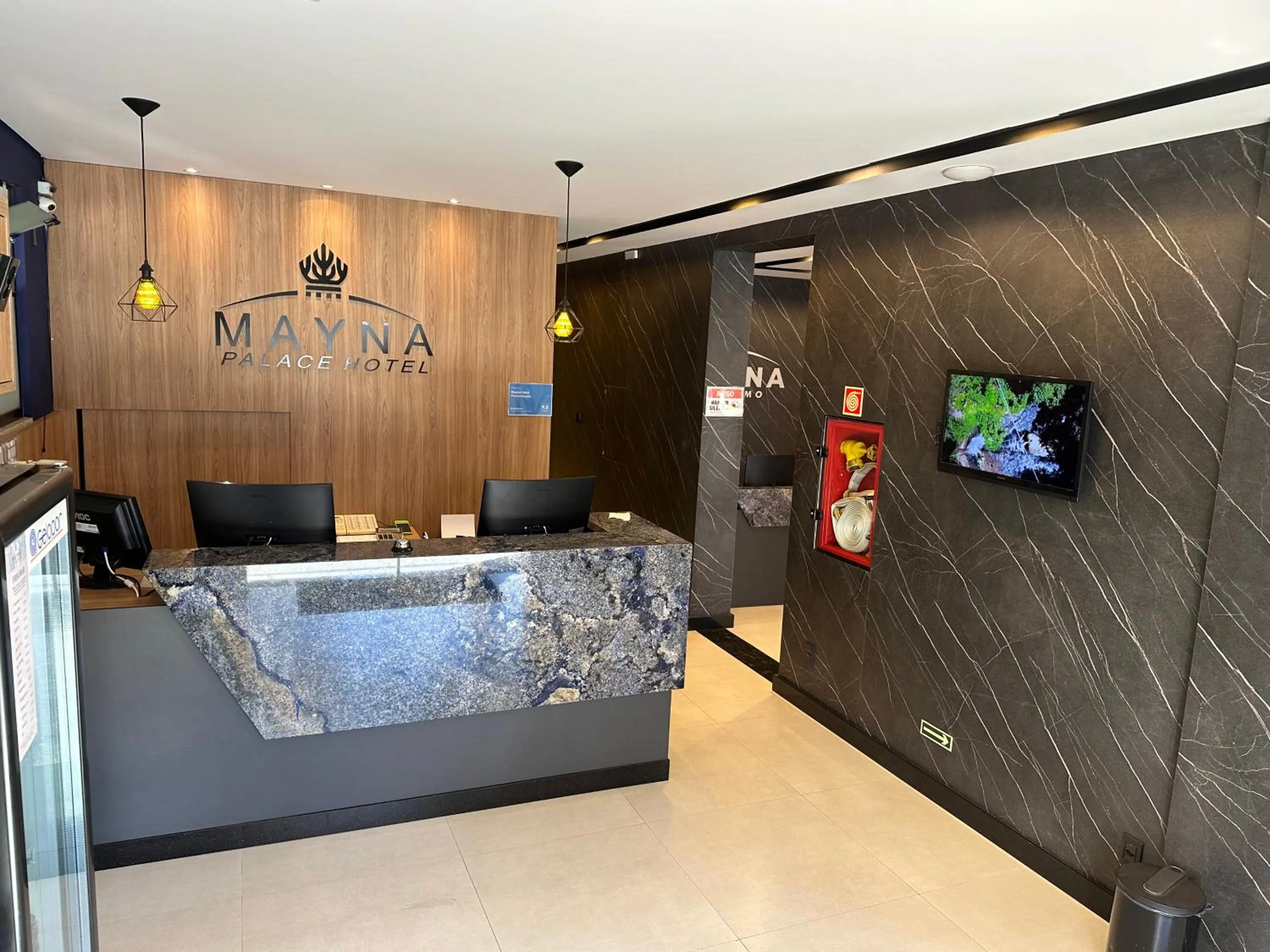 Communal lounge/ TV room in Mayná Hotel Prudentópolis Centro