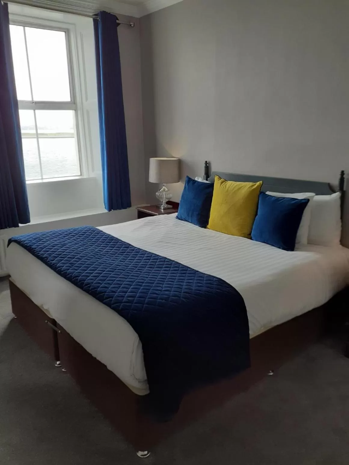 Bed in Commodore Hotel