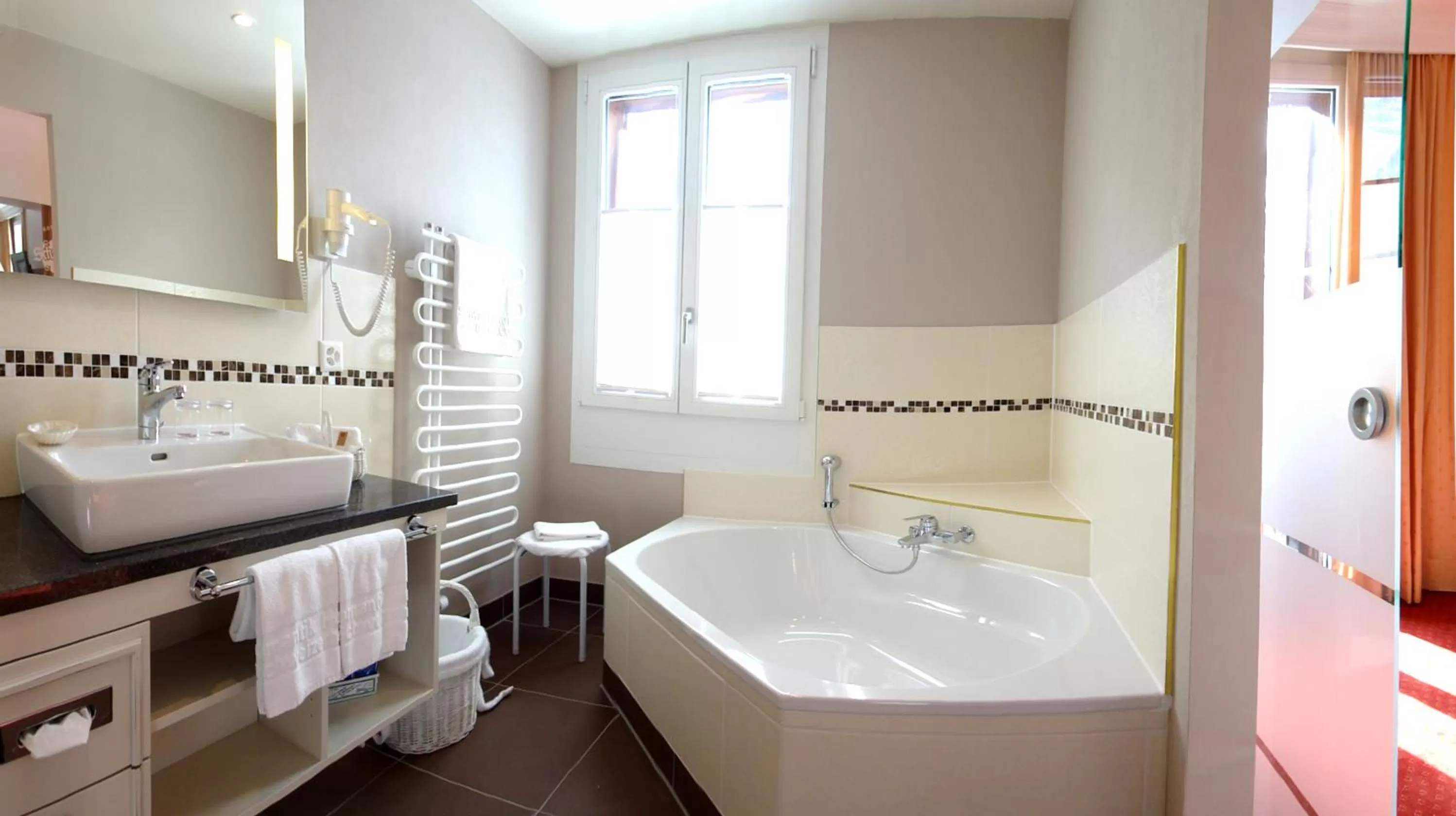 Bathroom, Bed in Romantik Hotel Schweizerhof