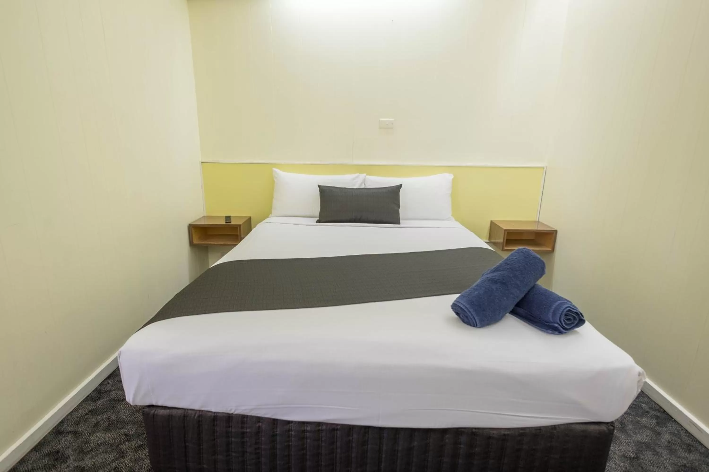 Bed in Pioneer Station Motor Inn