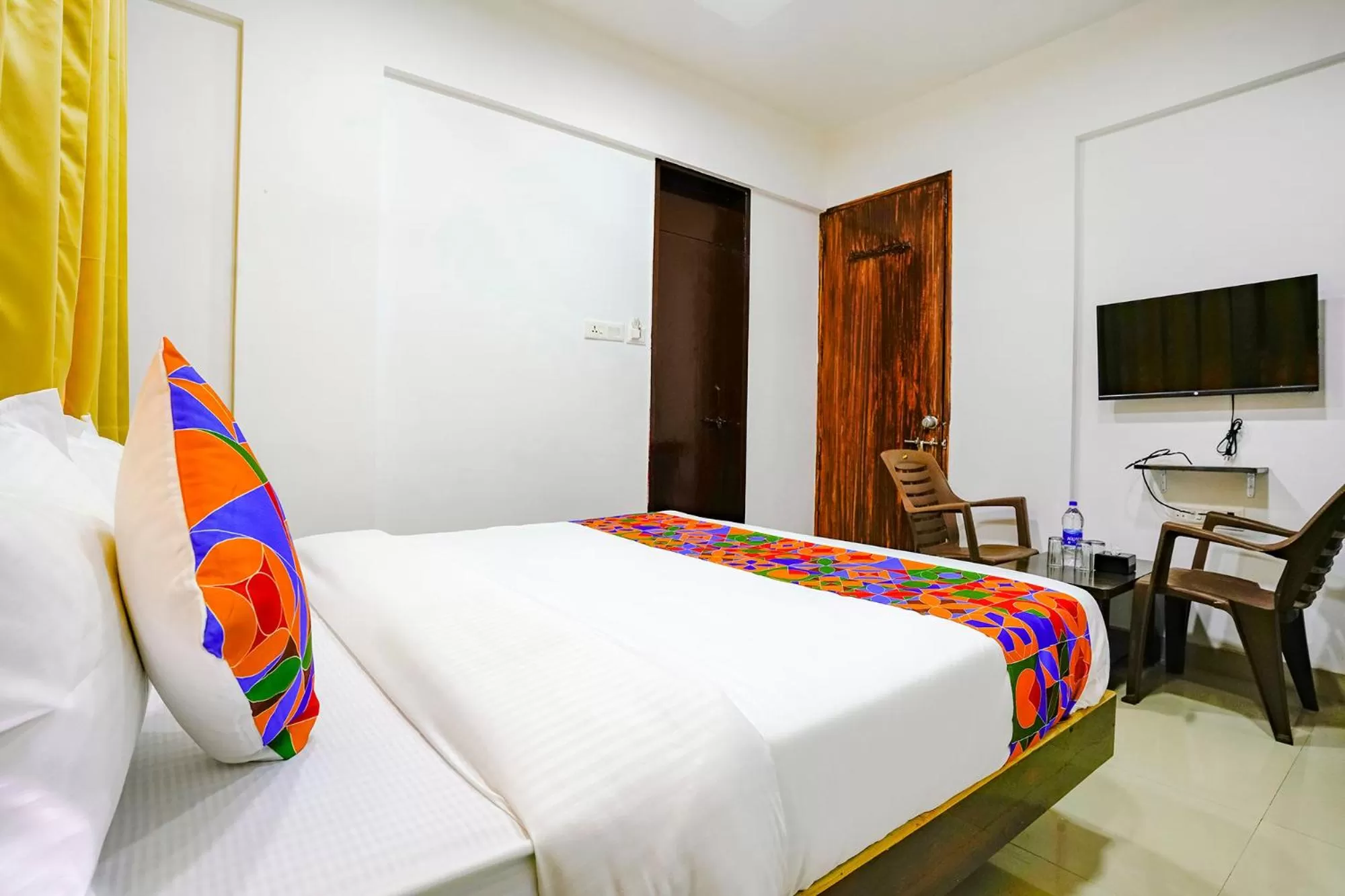 Bed in FabHotel Woods Regency