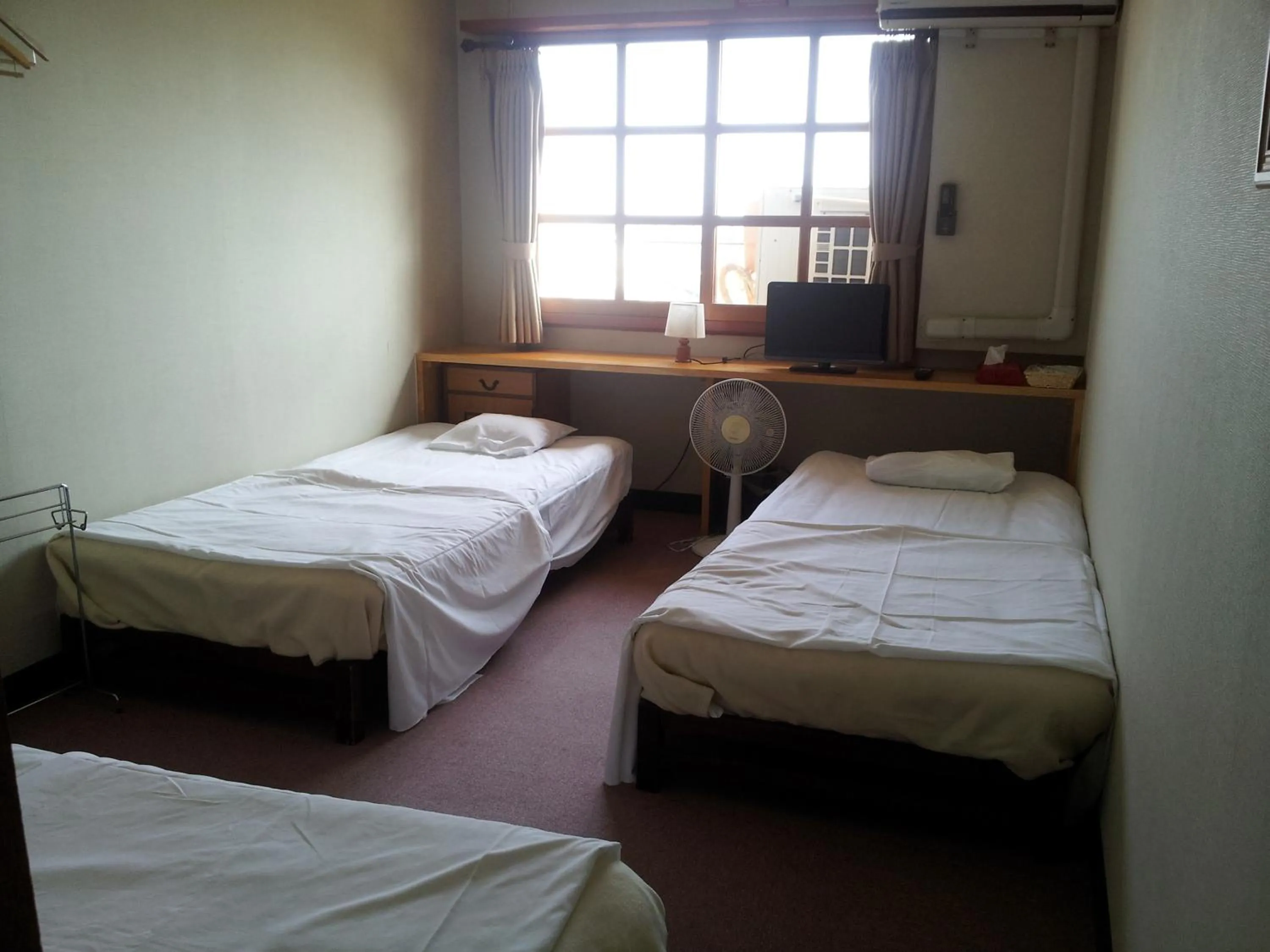 Bed in Orange Pension