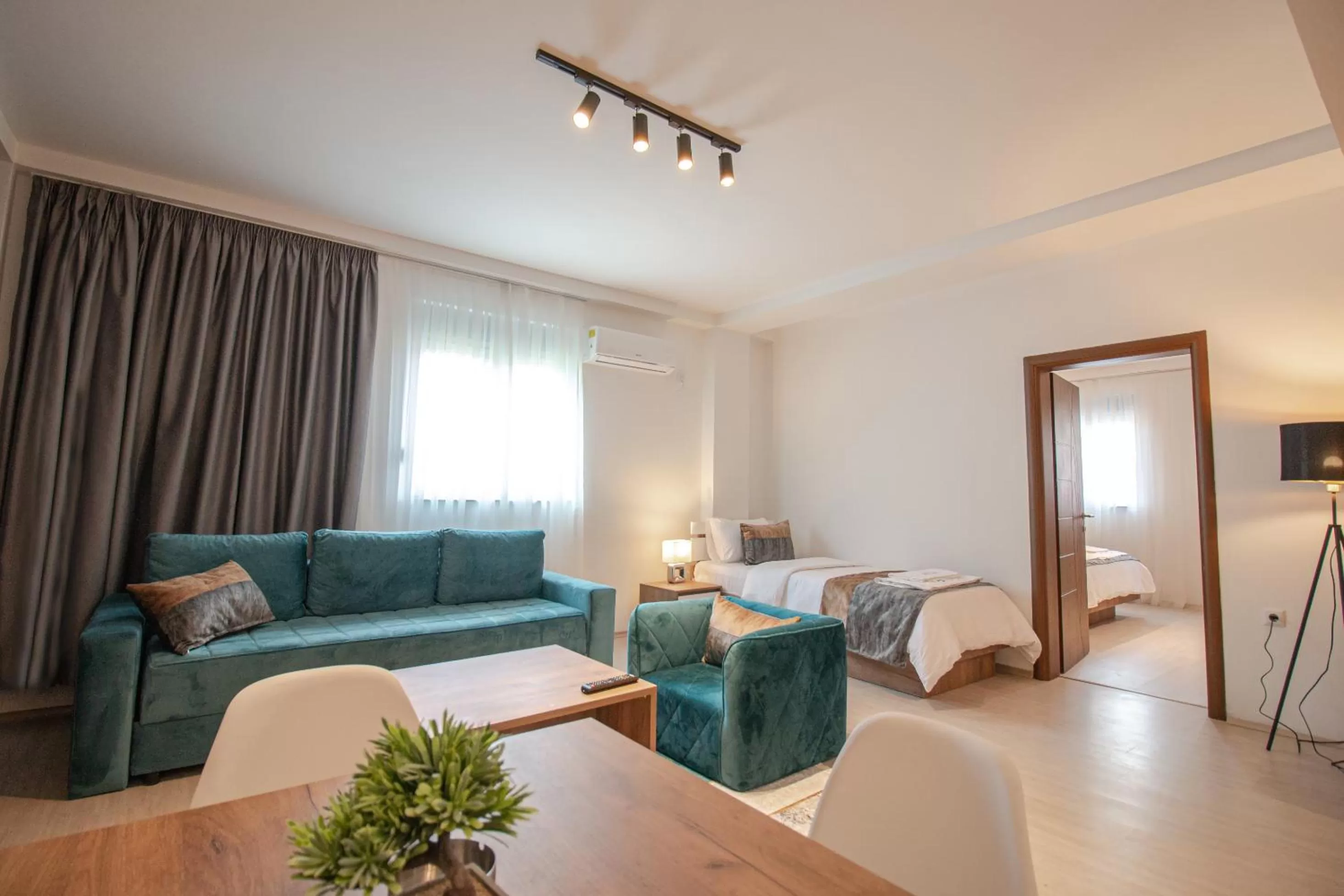 Living room, Bed in OASIS Apartments