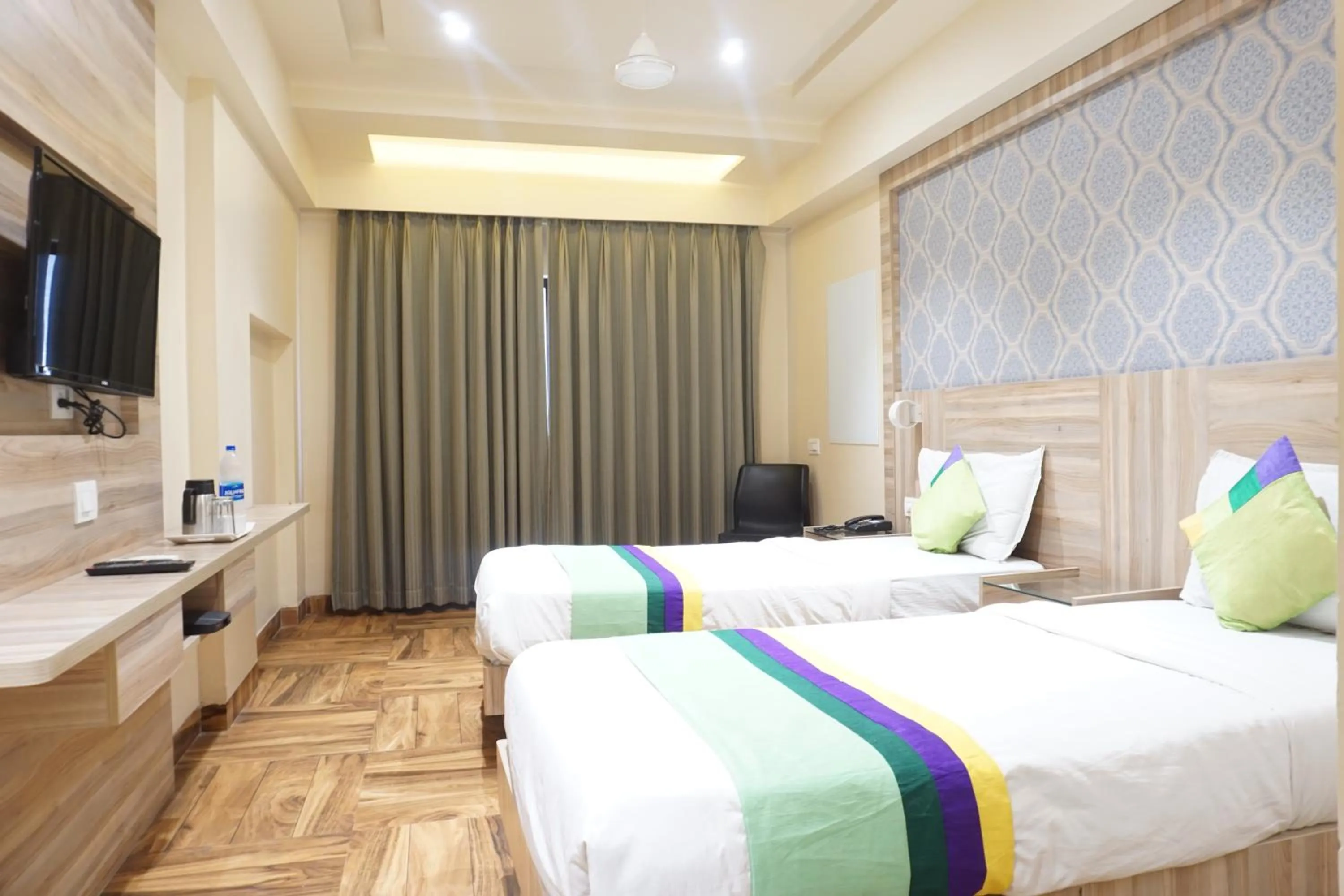 Bedroom, Bed in Treebo Classic Grande, Camp