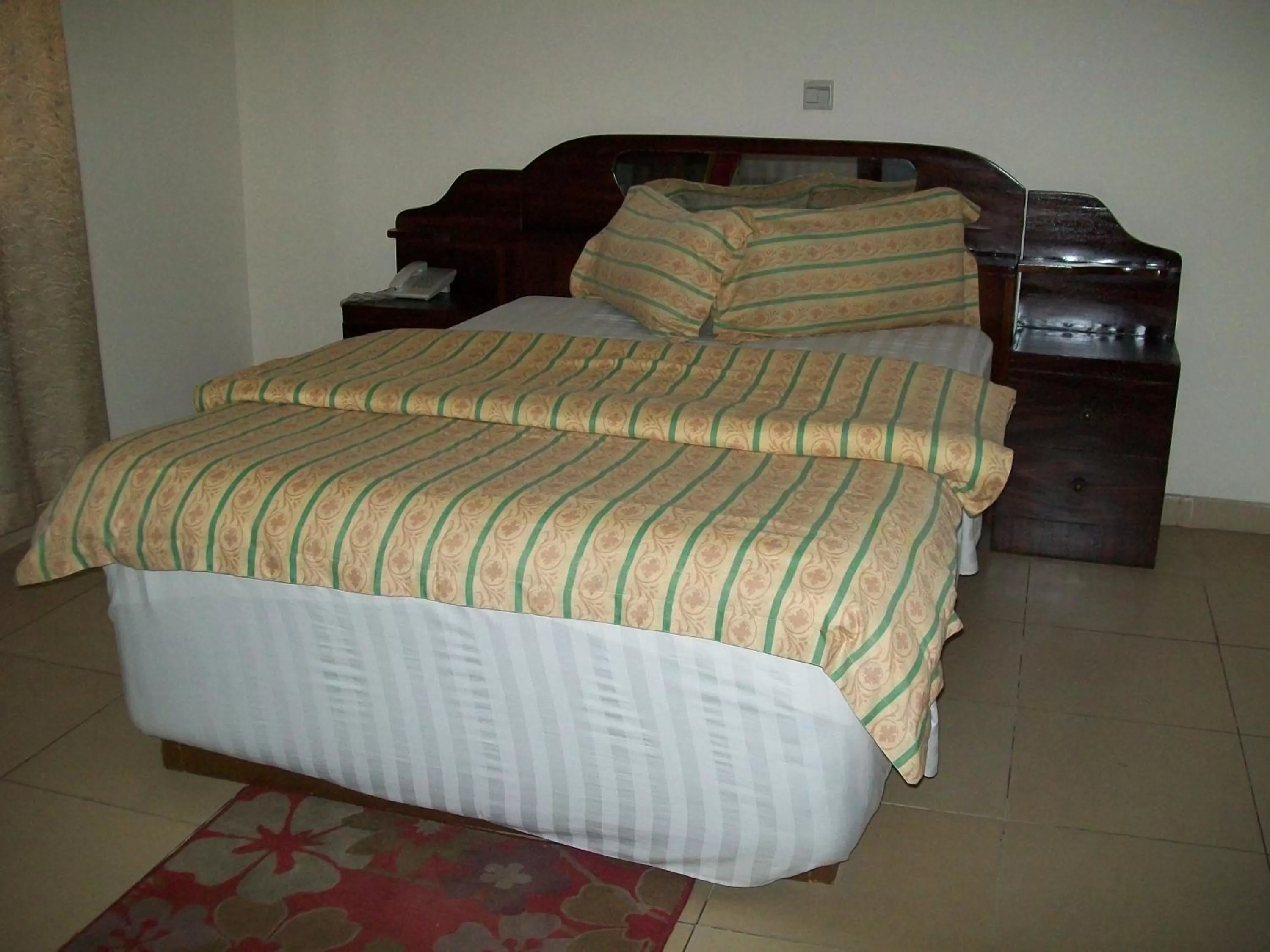 Bed in Ampomaah Hotel