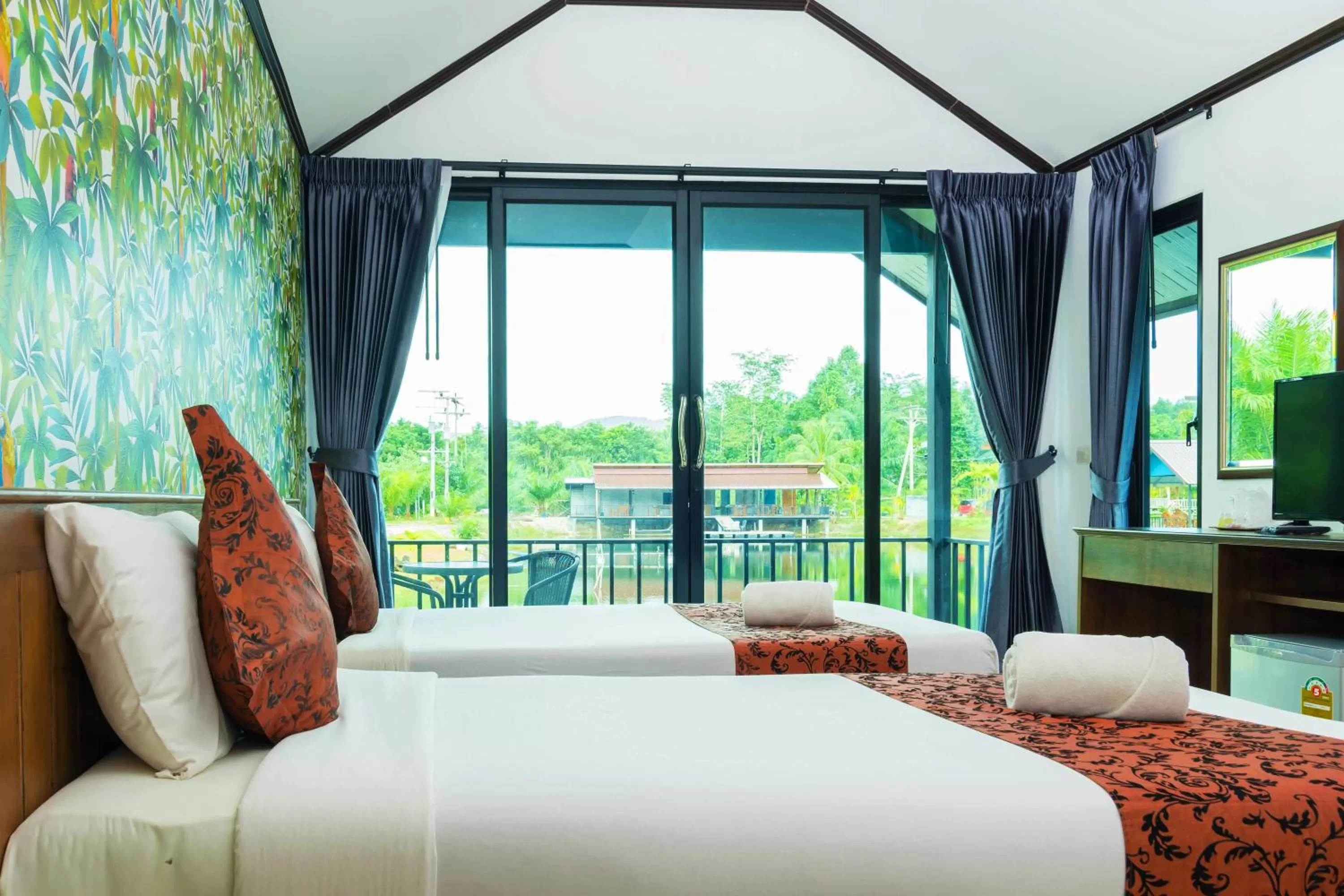 Bed in Baannai Lake View Resort