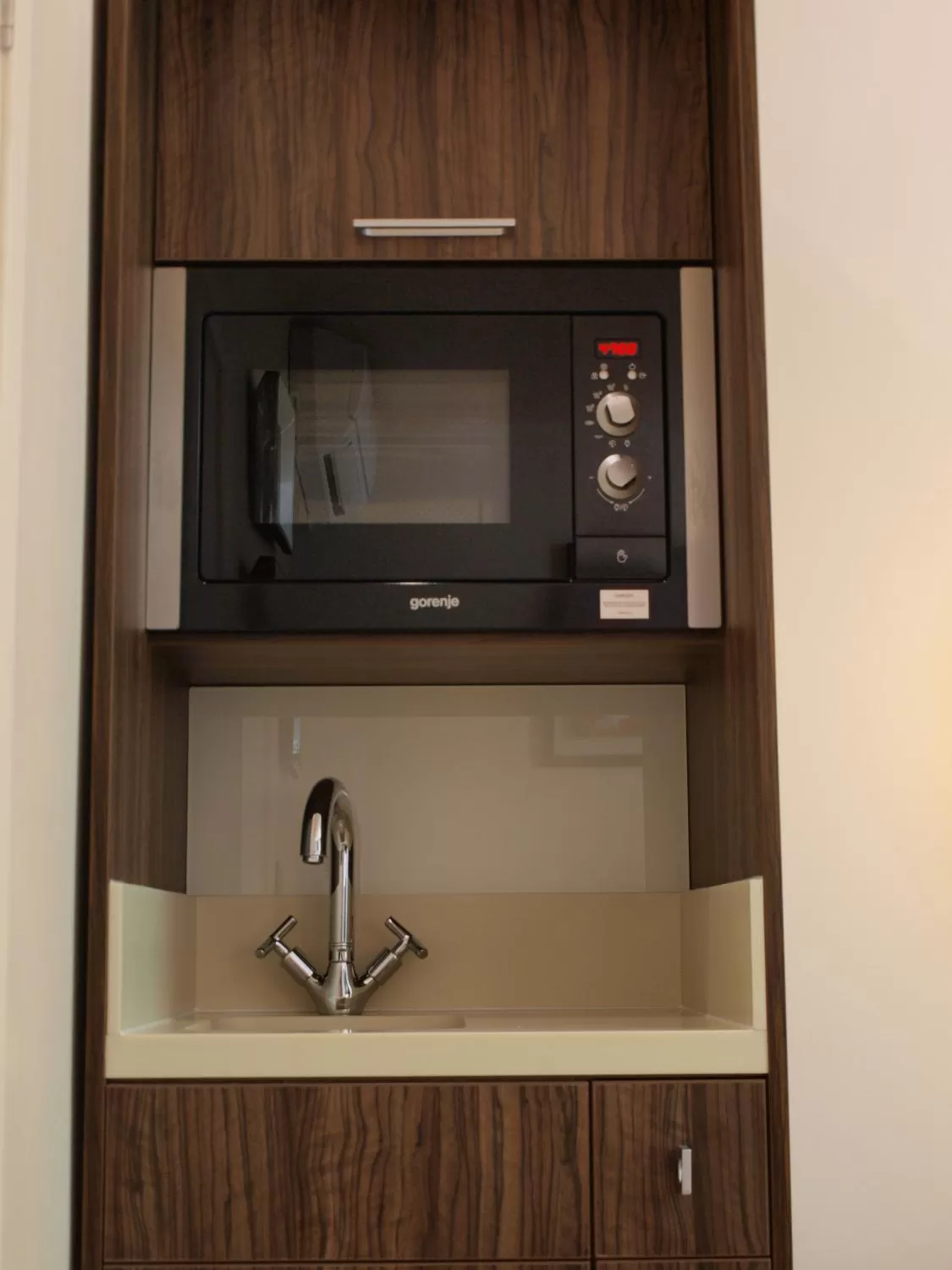 Kitchen or kitchenette in Simply Rooms & Suites