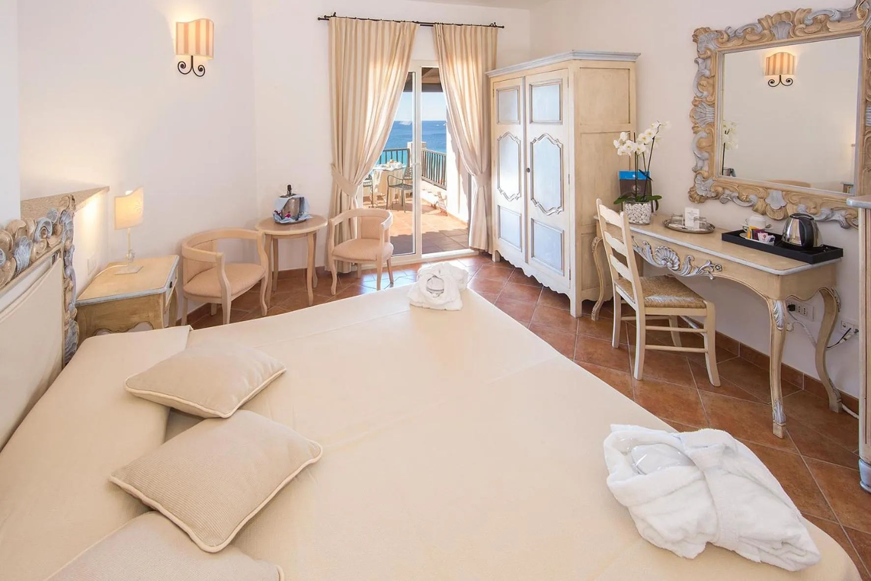 Photo of the whole room, Bed in COLONNA GRAND HOTEL CAPO TESTA, a Colonna Luxury Beach Hotel, Santa Teresa Sardegna