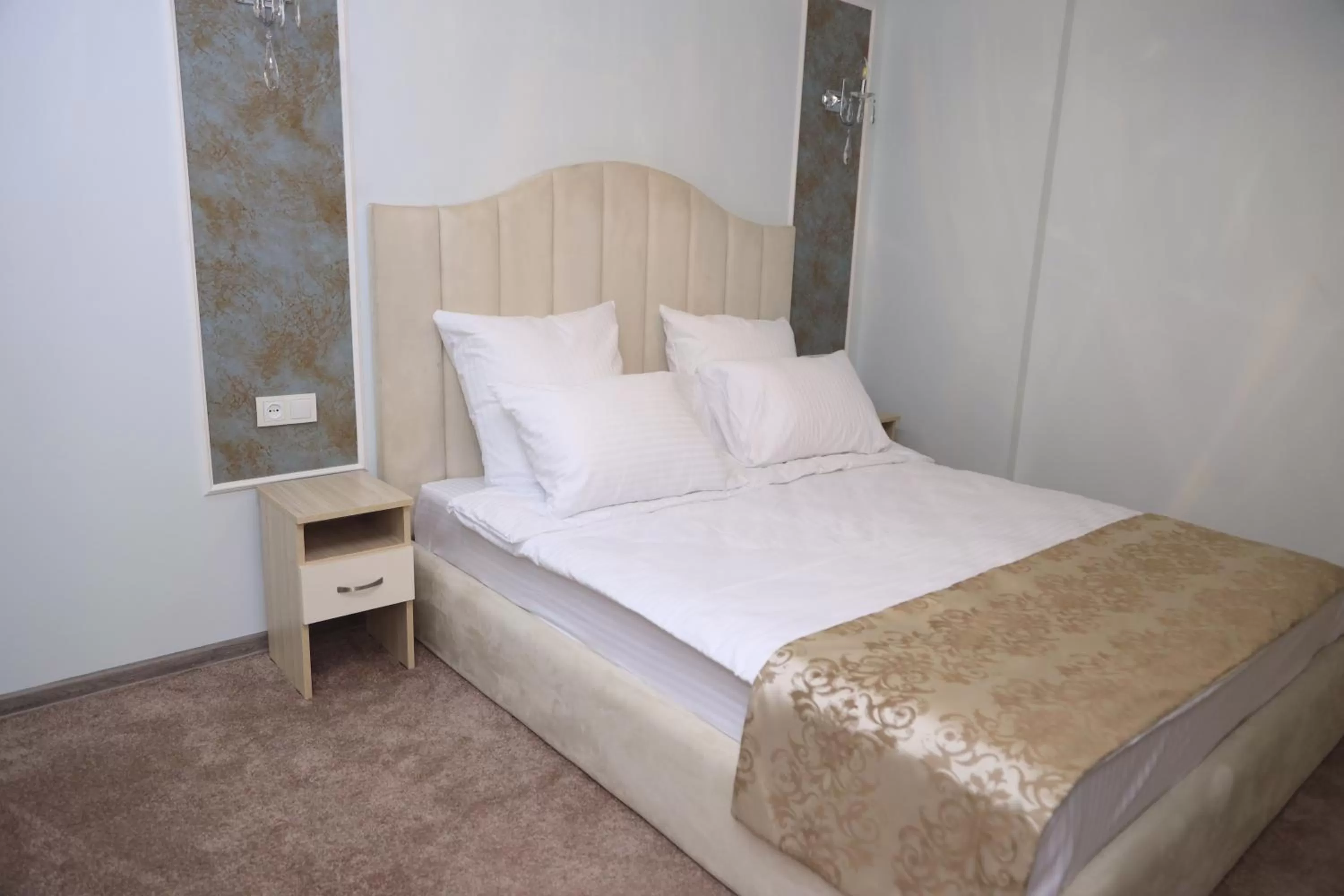 Bed in DeLin Hotel And Tours