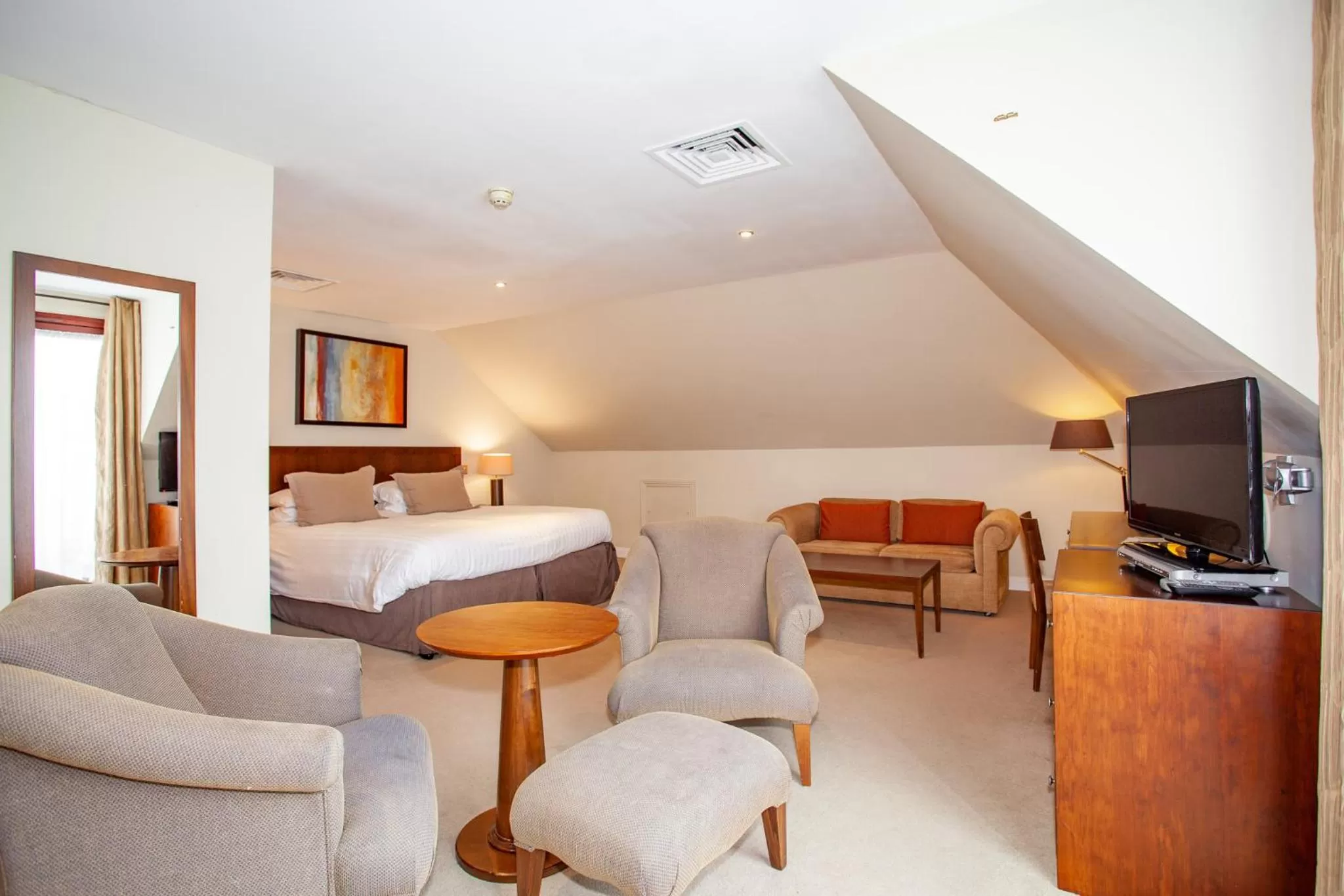 Bed, Seating Area in Hustyns Resort Cornwall