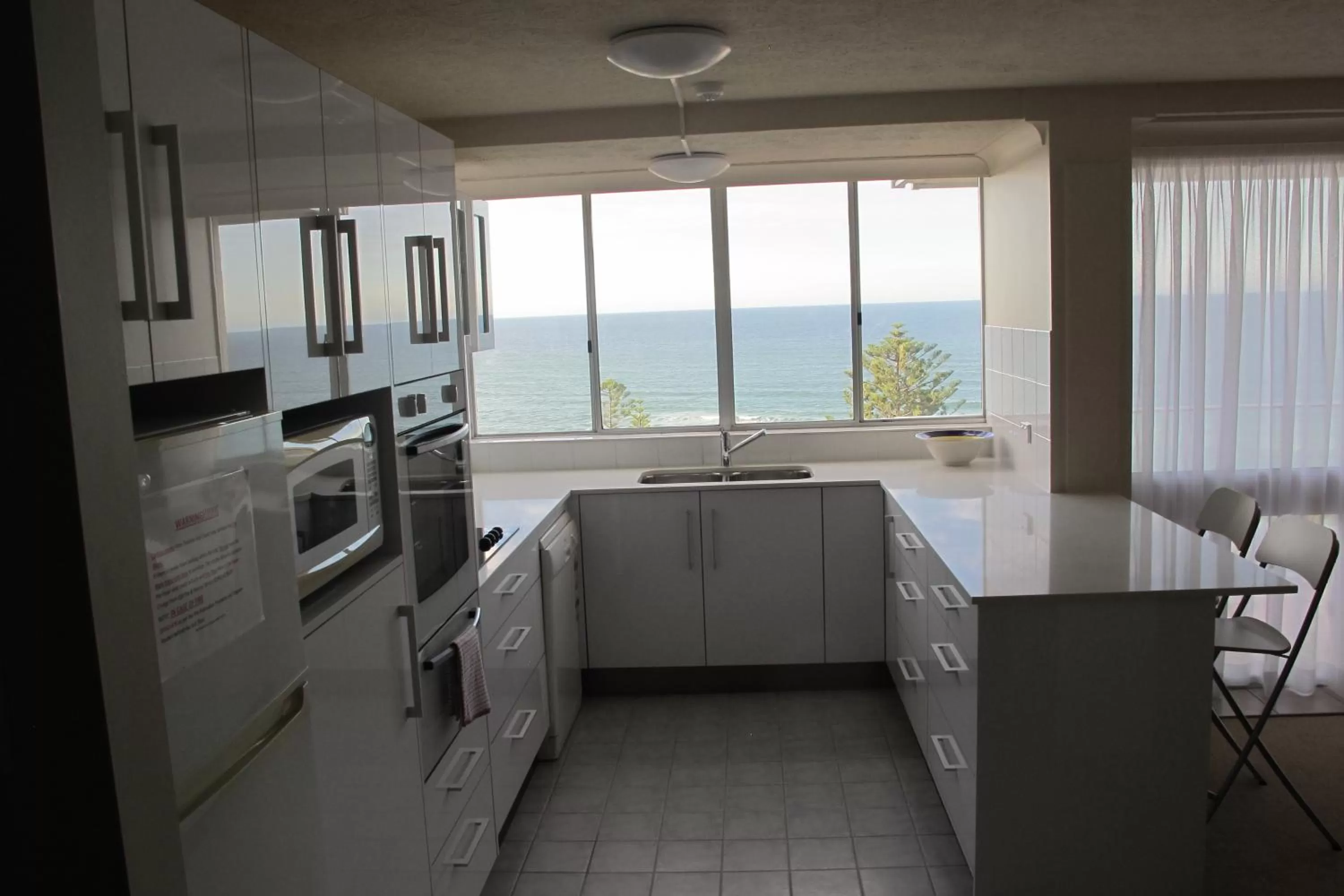 Kitchen or kitchenette in Pacific Regis Beachfront Holiday Apartments