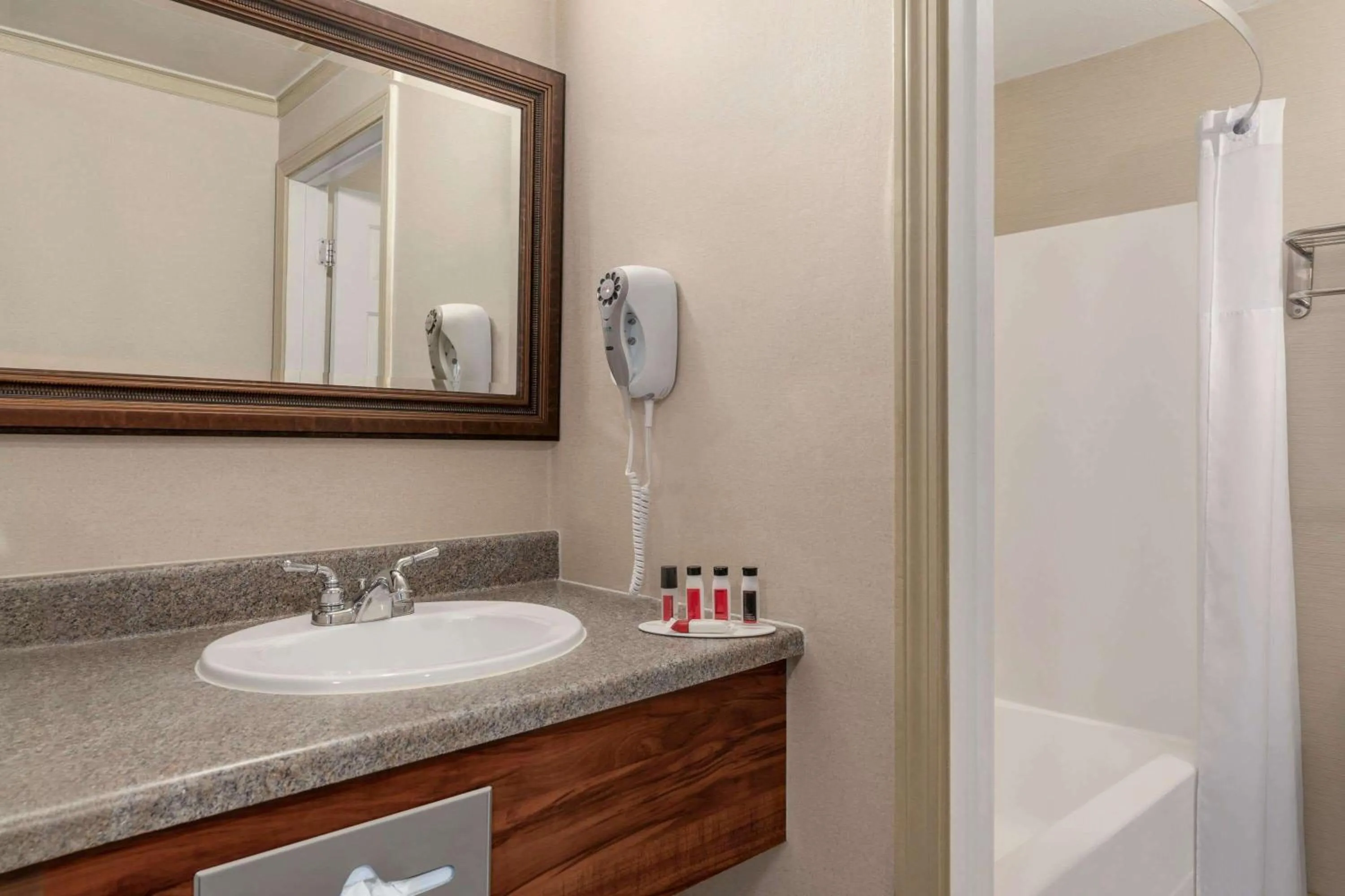 Bathroom in Days Inn by Wyndham Airport/Maine Mall