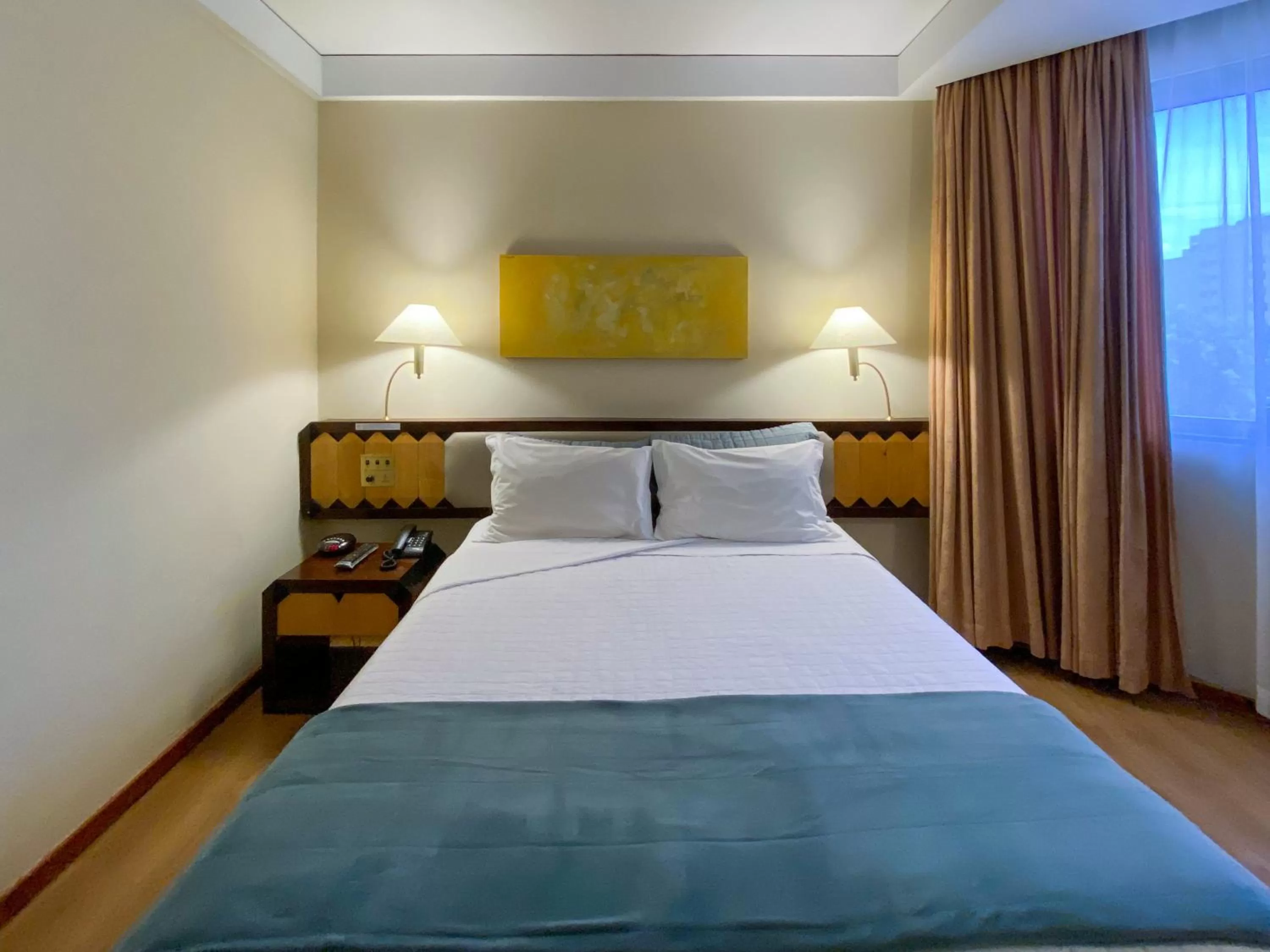 Bed in Golden Tower Pinheiros by Fênix Hotéis