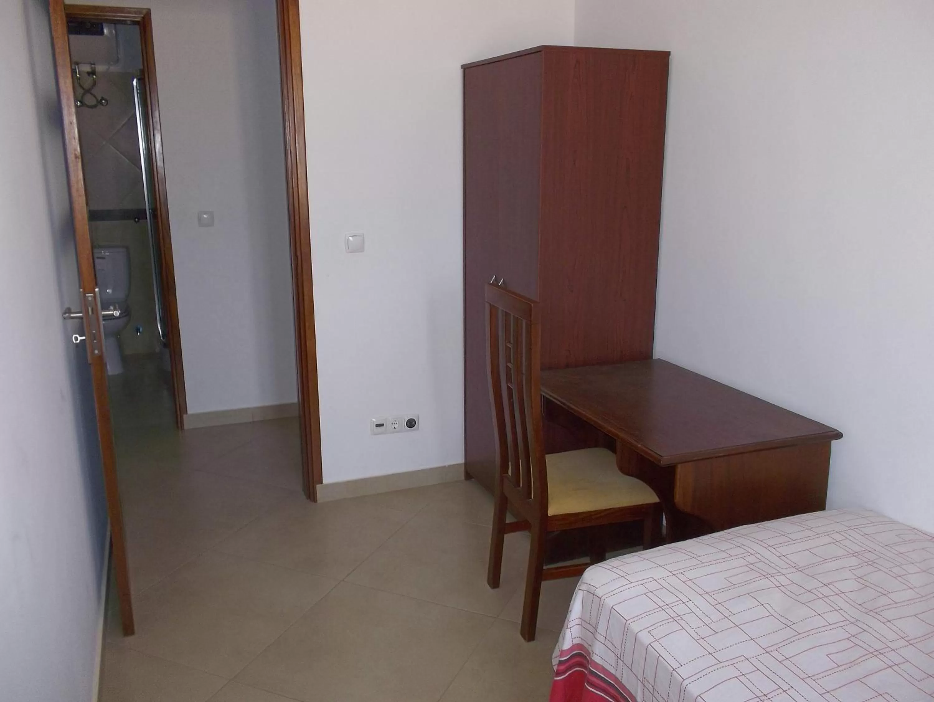 Photo of the whole room, TV/Entertainment Center in Basic Hotel