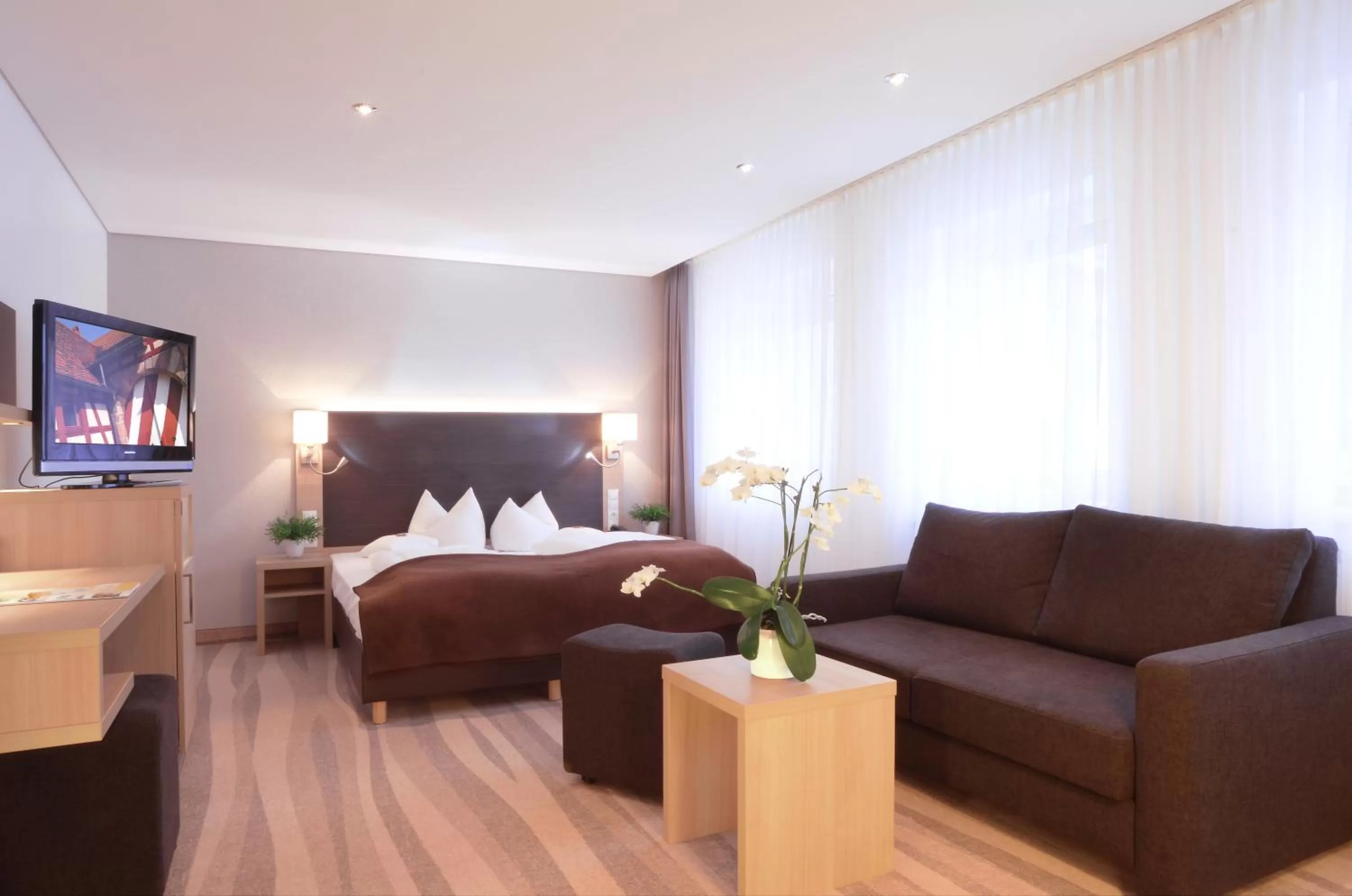 Photo of the whole room, Bed in Ringhotel Loew's Merkur