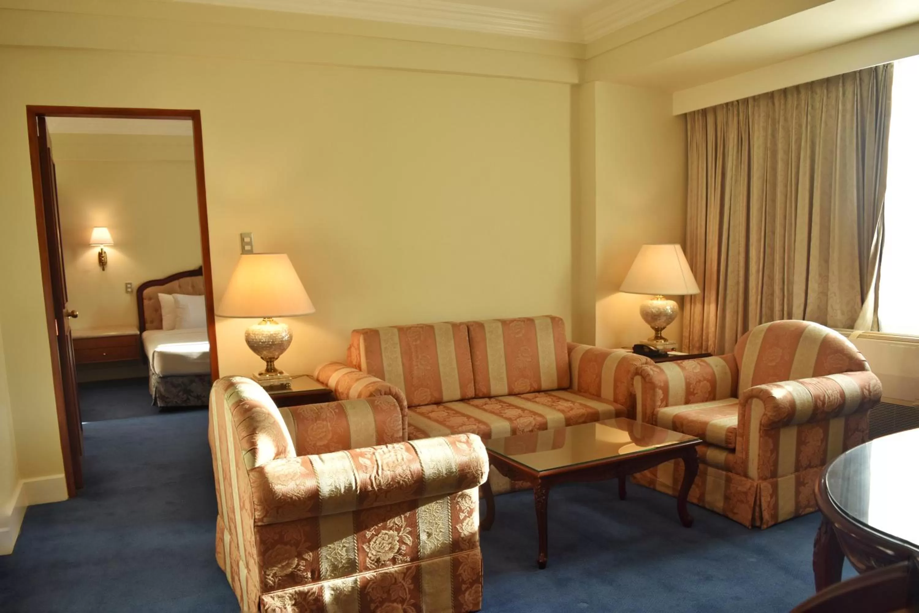 Living room, Bed in Manila Prince Hotel