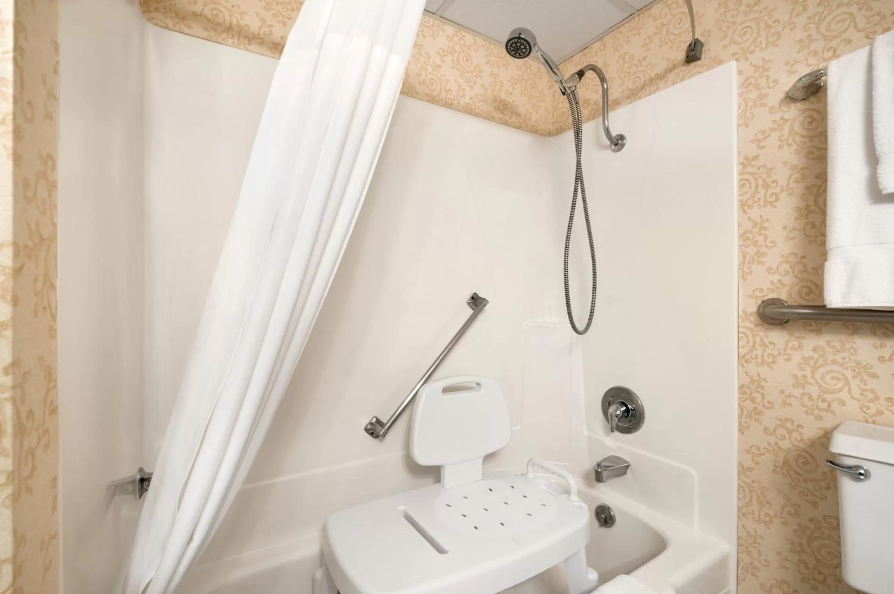 Bathroom in Ramada Plaza by Wyndham Gillette Conference Center