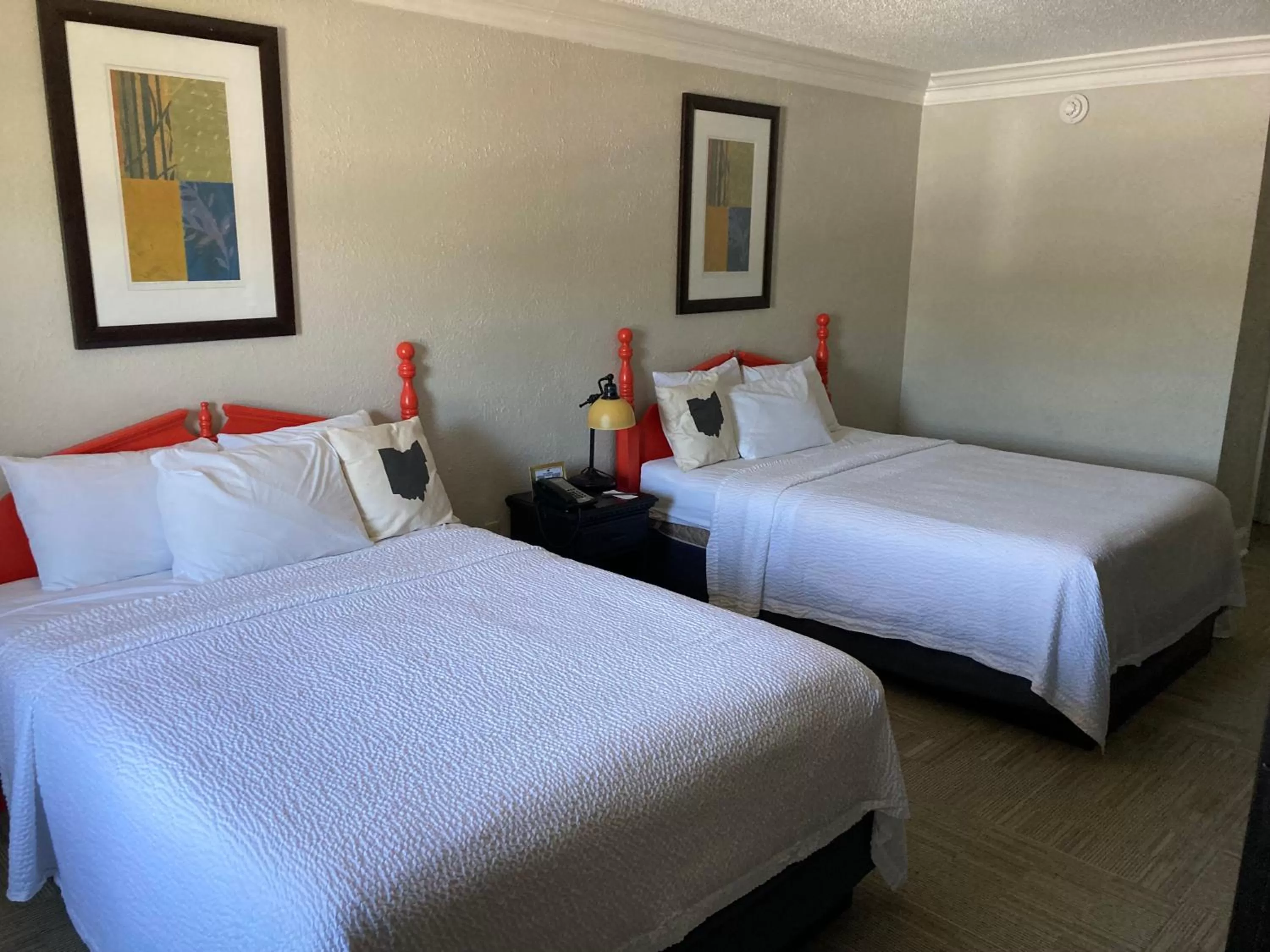 Bed in The Aurora Inn Hotel and Event Center