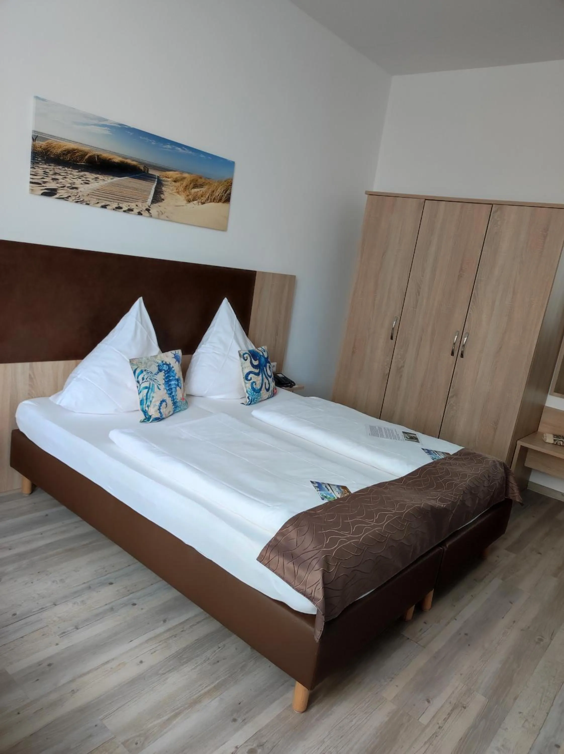 Photo of the whole room, Bed in Nordsee Hotel Borkum