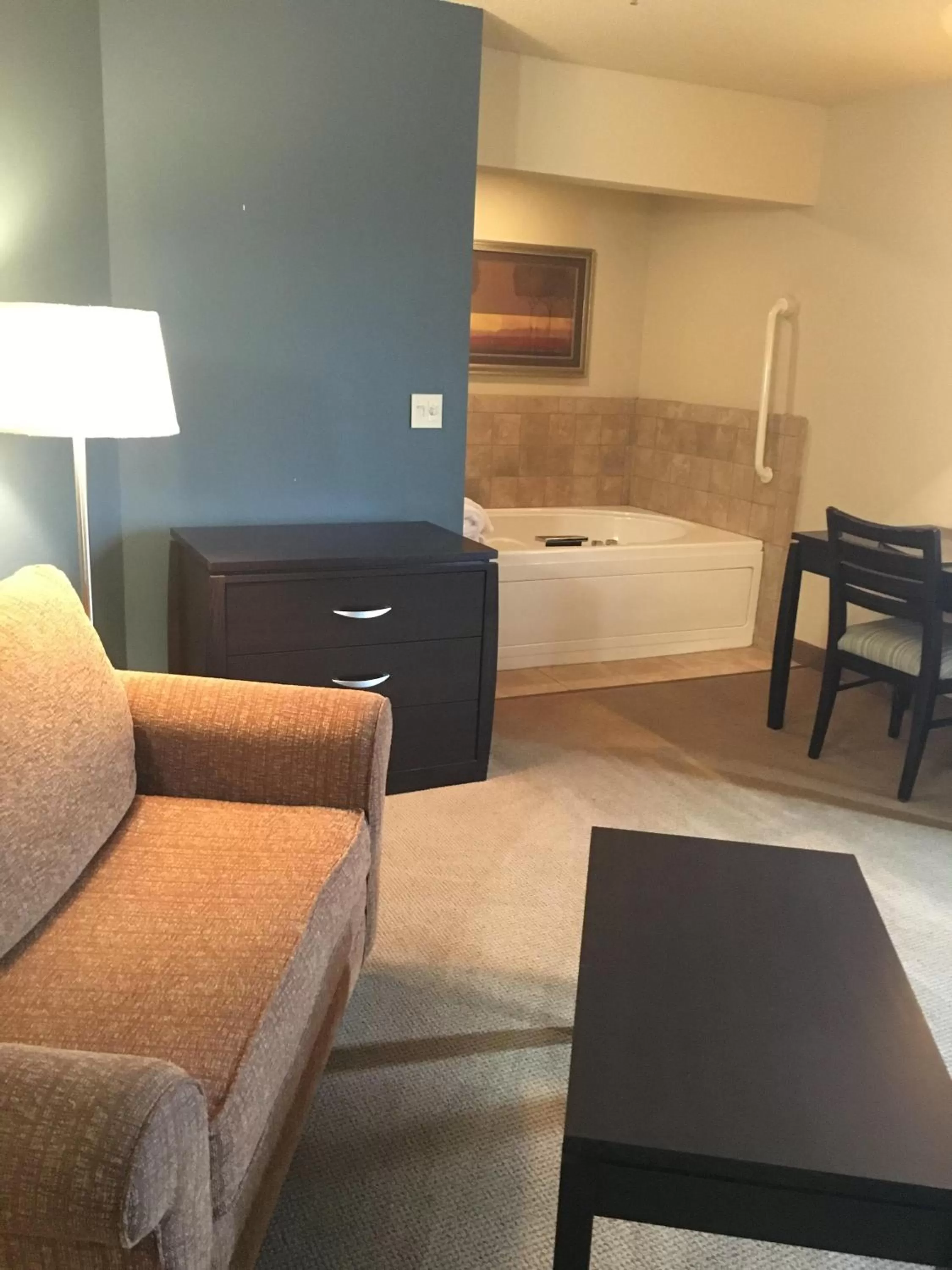 Bed in AmericInn by Wyndham Monmouth