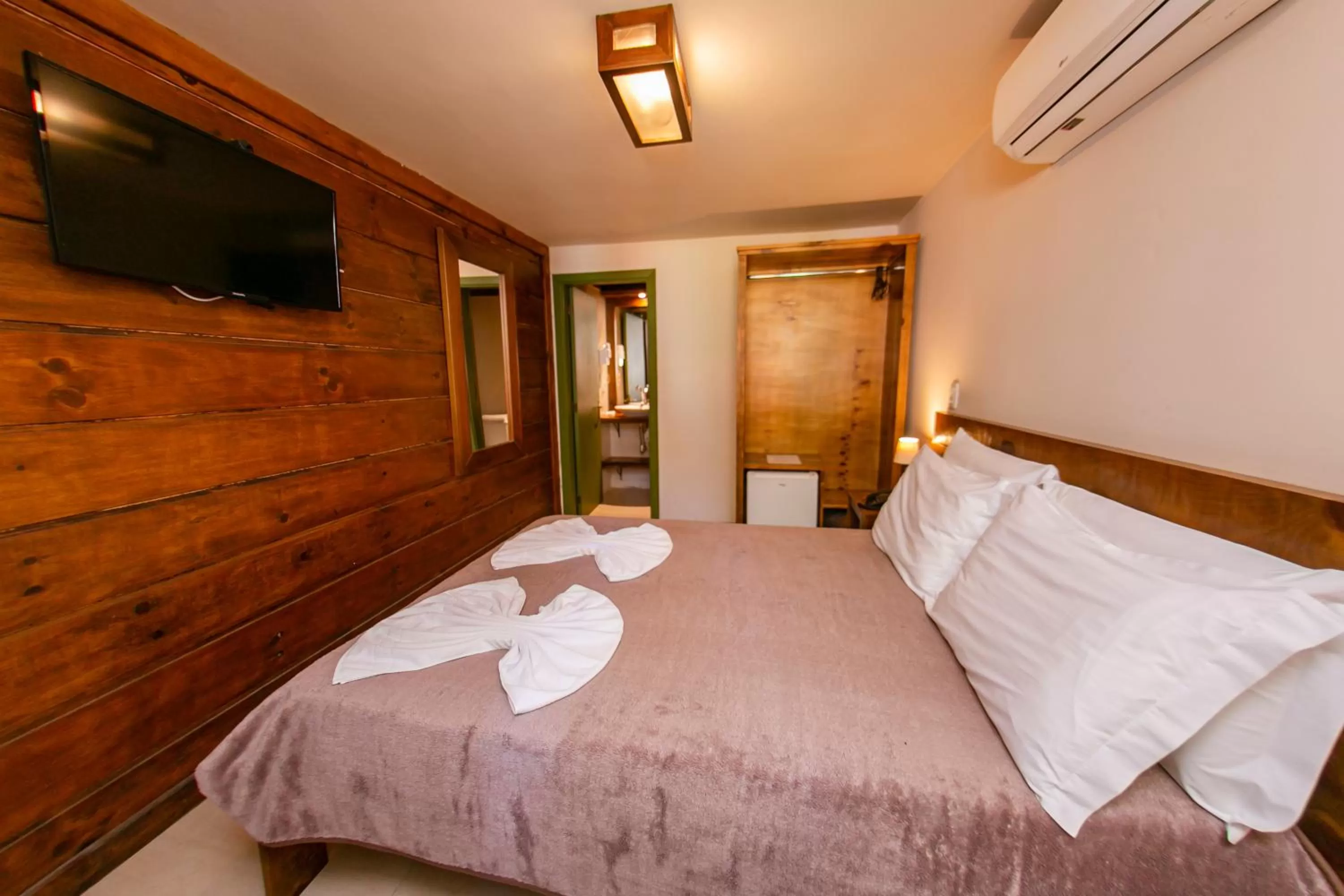 Bed in Pousada Charm Canela