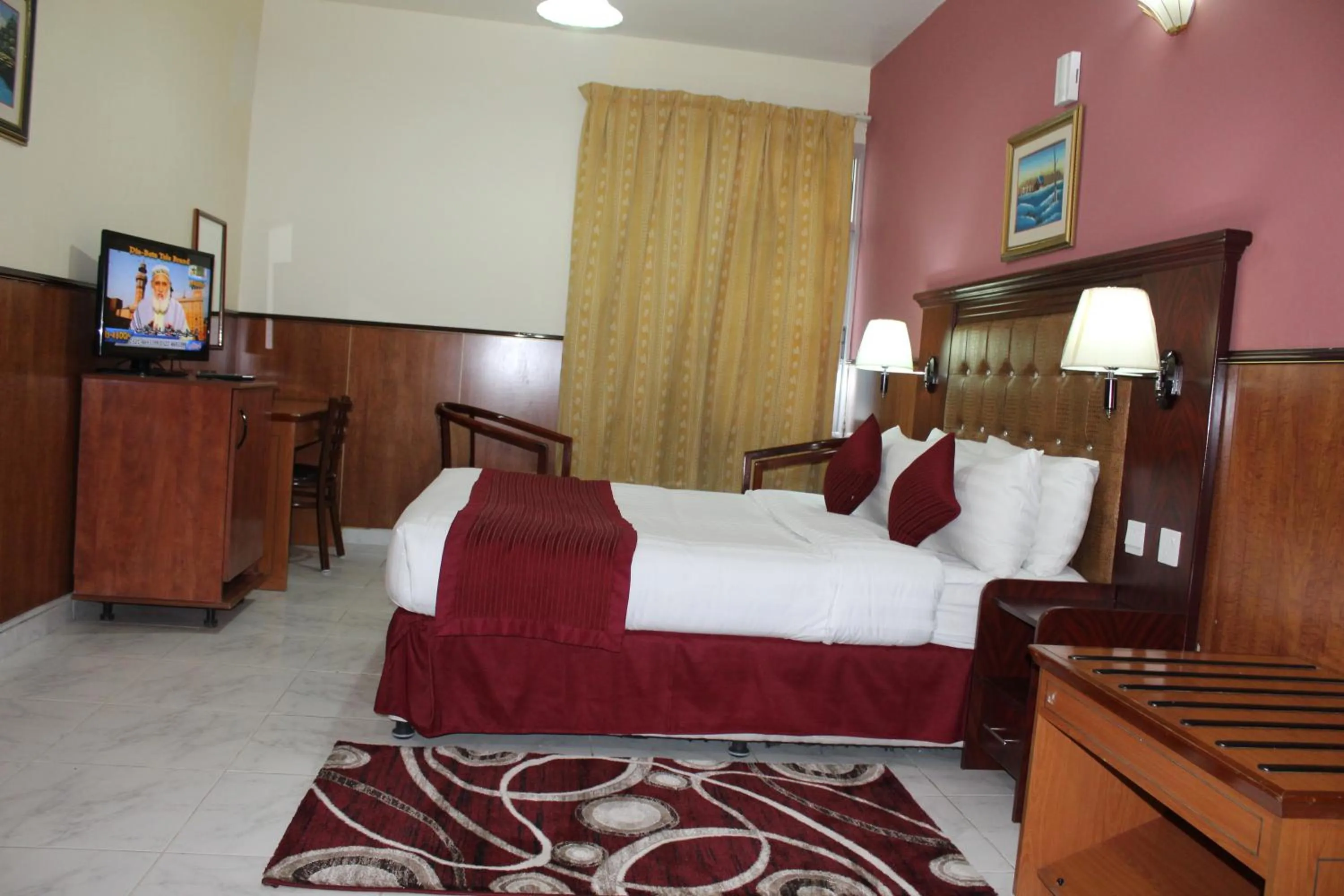 Bed in Grand Nova Hotel